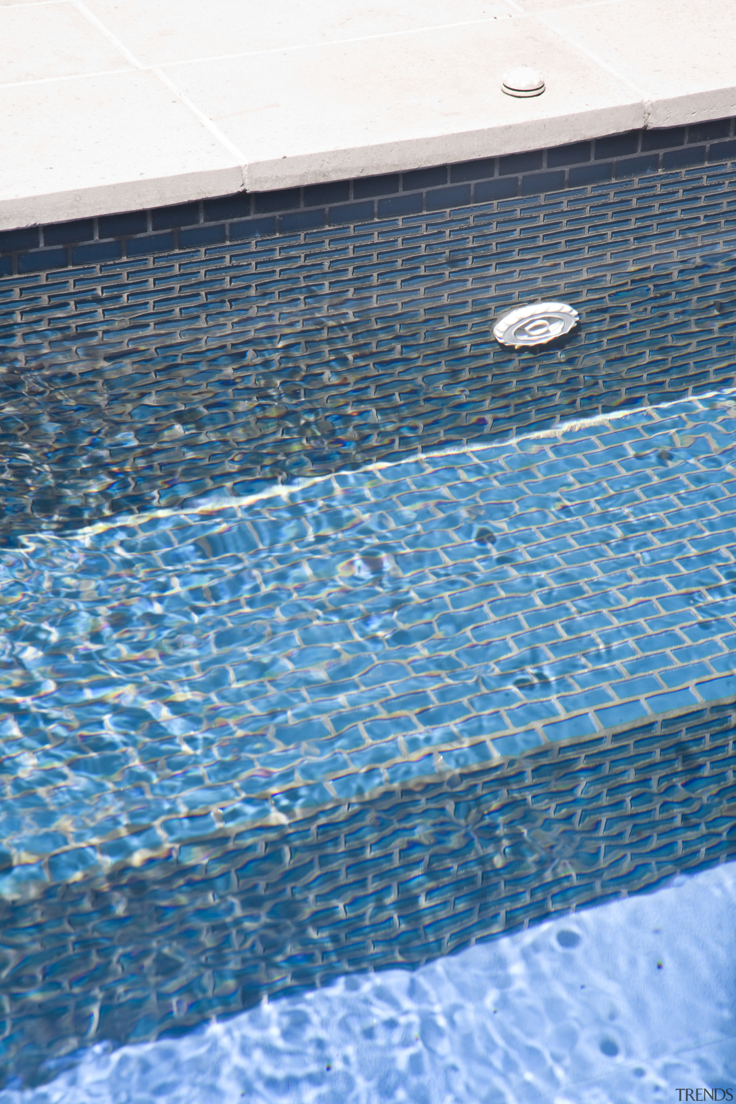 View of the pool tiling and paving. - azure, blue, floor, line, net, pattern, wall, water, teal