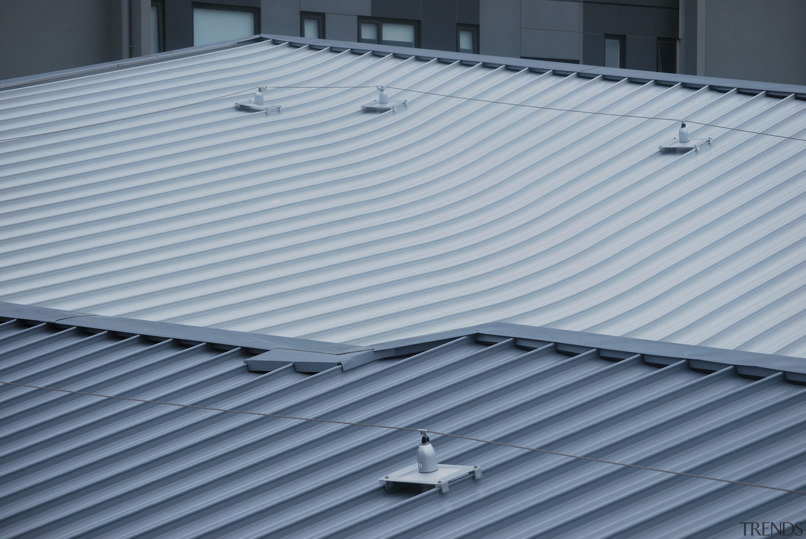 A KingZip SF standing-seam interlocking roof system was architecture, daylighting, roof, structure, gray, blue