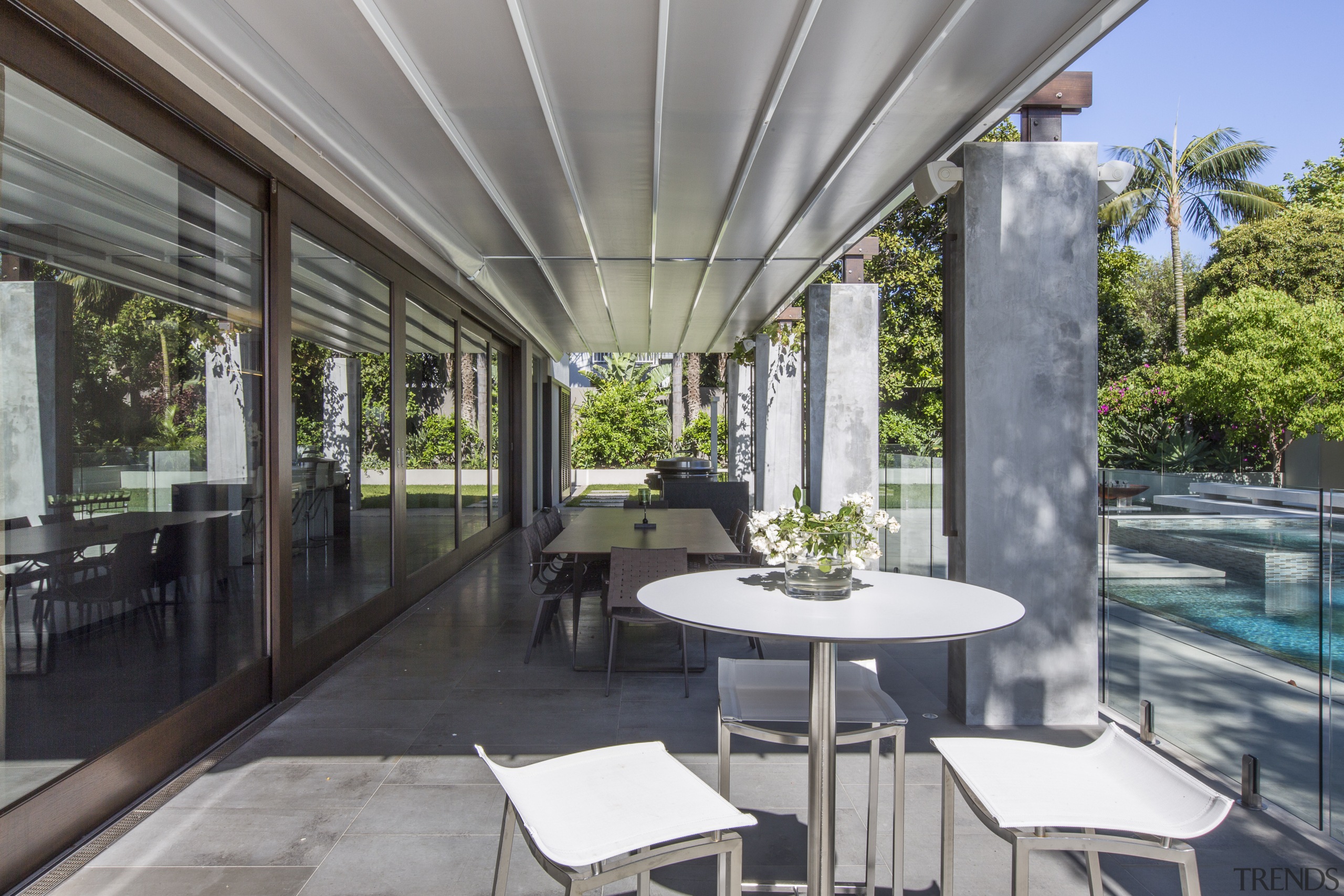 Large sliding doors open up this remodelled house interior design, outdoor structure, patio, real estate, roof, gray