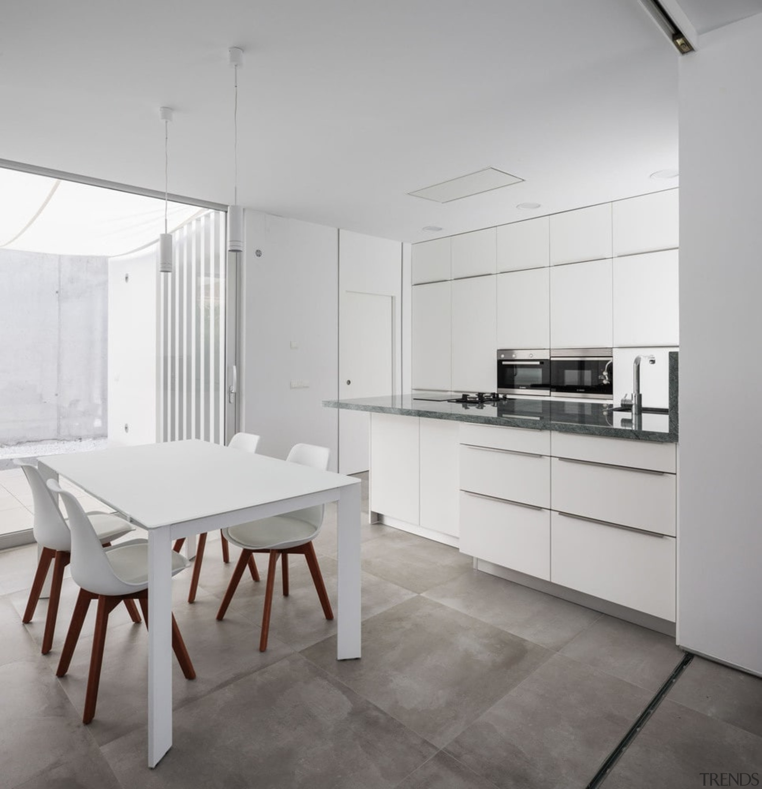 The kitchen features a similar white aesthetic found architecture, countertop, floor, flooring, interior design, kitchen, table, gray