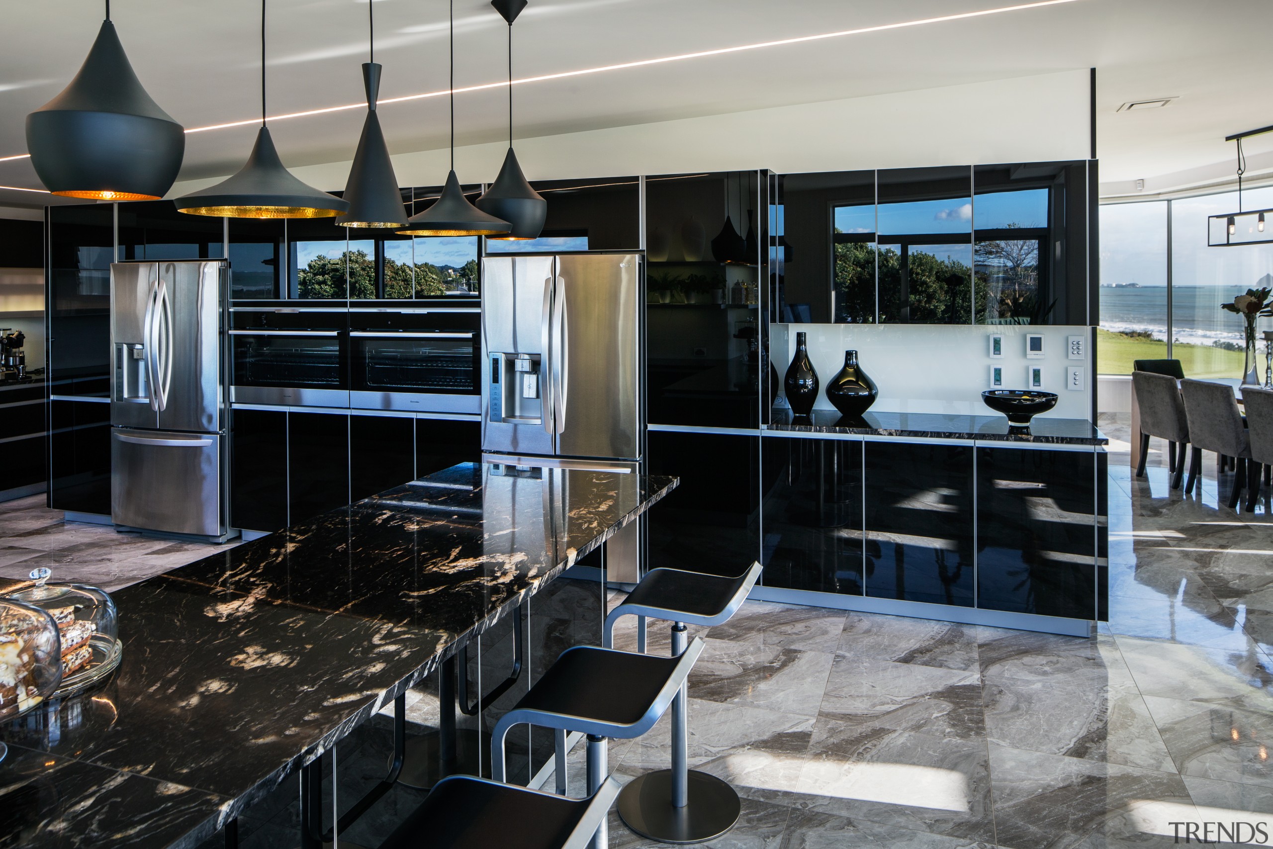 Designer Damian Hannah specified black German glass doors countertop, interior design, kitchen, gray, black