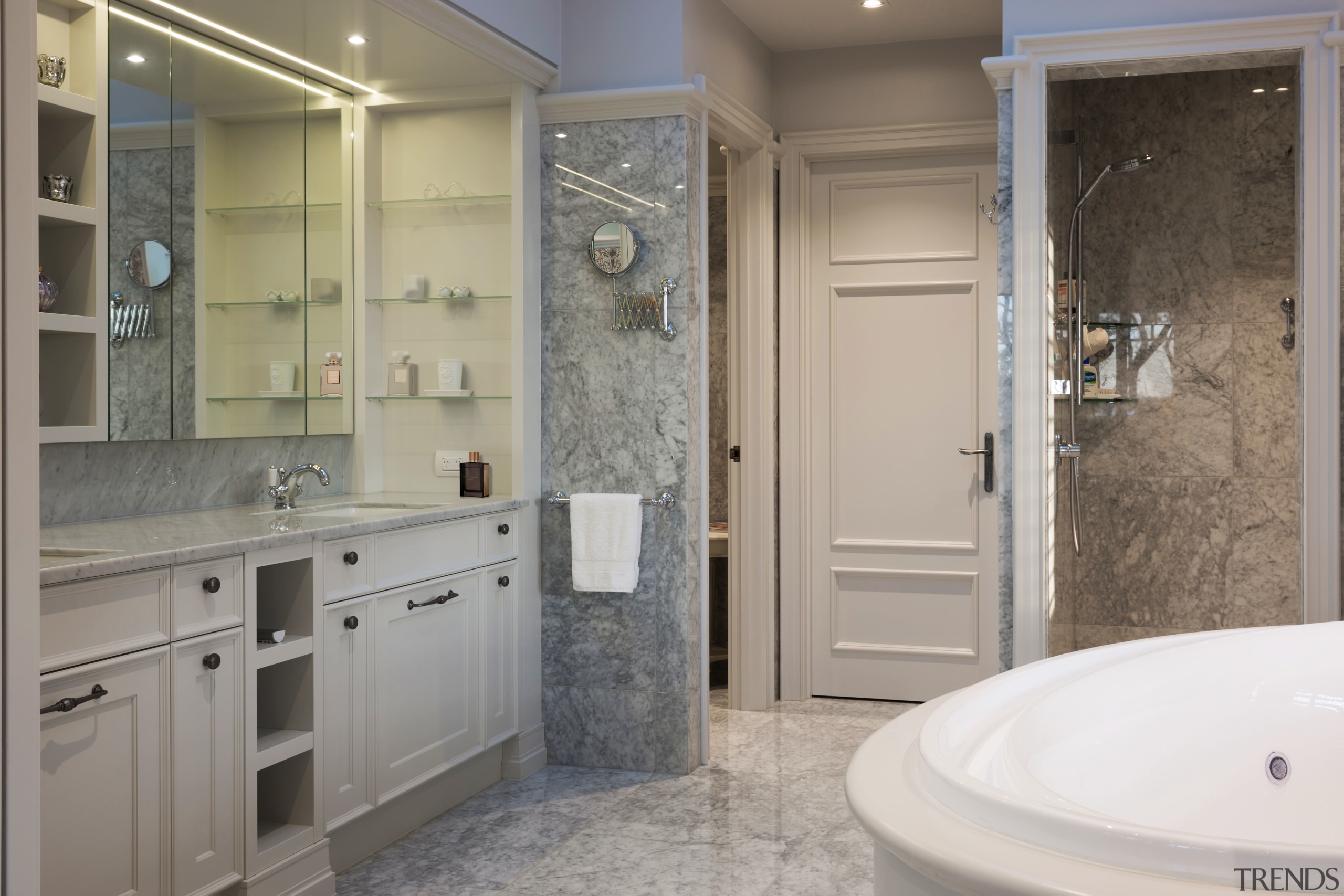 The intricately worked cabinetry in this master bathroom bathroom, bathroom accessory, bathroom cabinet, floor, home, interior design, room, gray