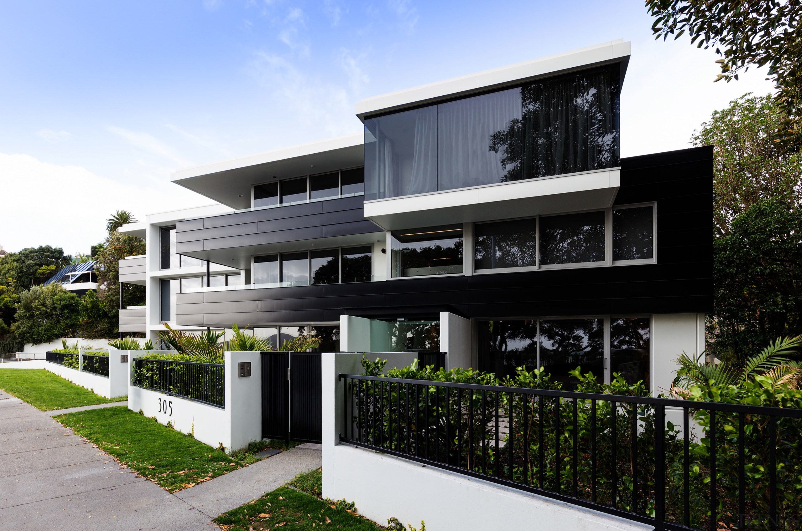 These new apartments at 305 Tamaki Drive, Kohimarama architecture, building, condominium, corporate headquarters, elevation, facade, home, house, mixed use, property, real estate, residential area, black, white