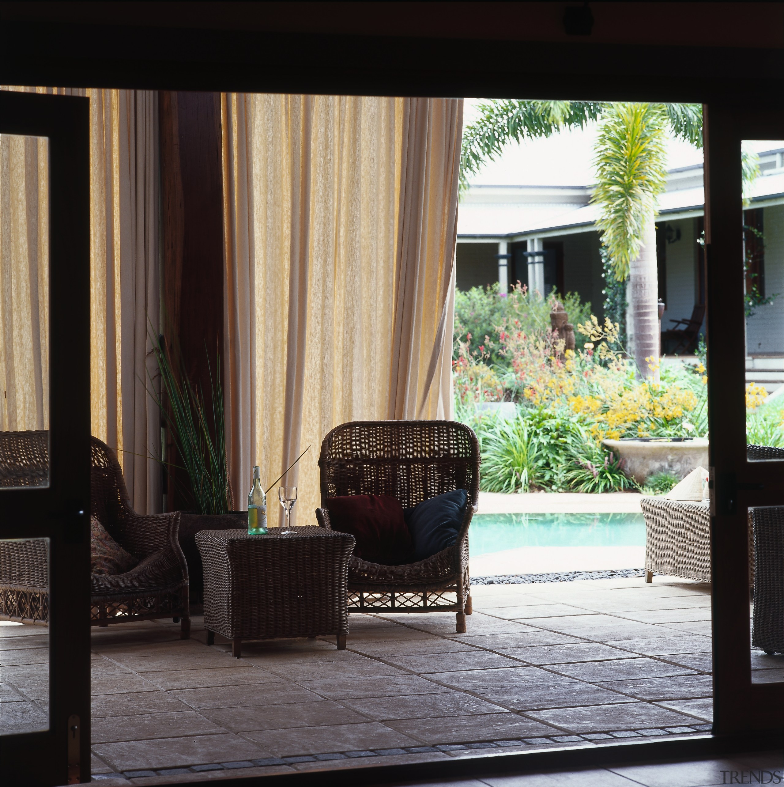 View of this outdoor living area - View chair, door, floor, furniture, home, house, interior design, living room, outdoor furniture, outdoor structure, patio, porch, shade, table, window, window covering, window treatment, wood, black
