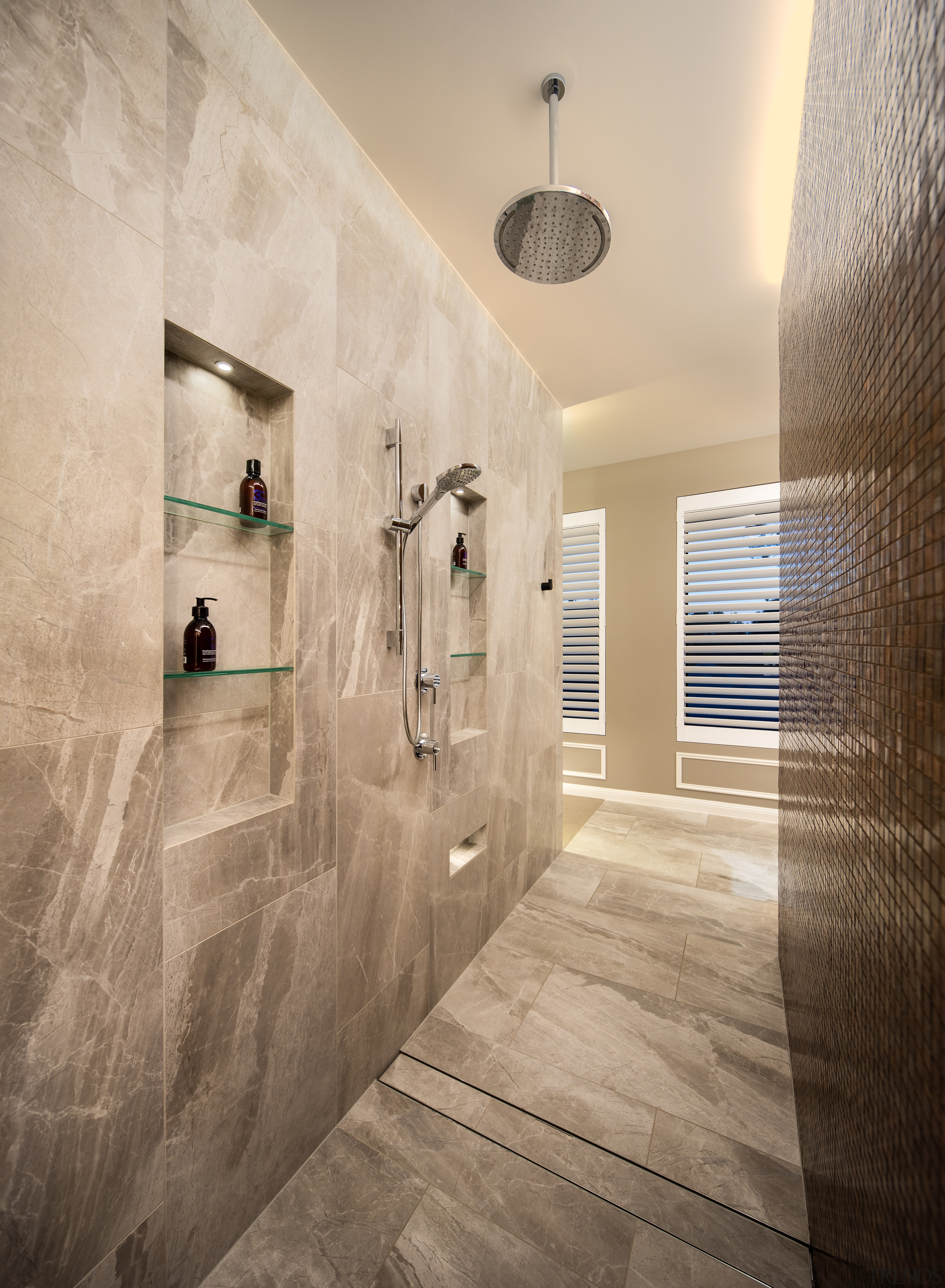 The ensuite features a tiled walk-through shower with 