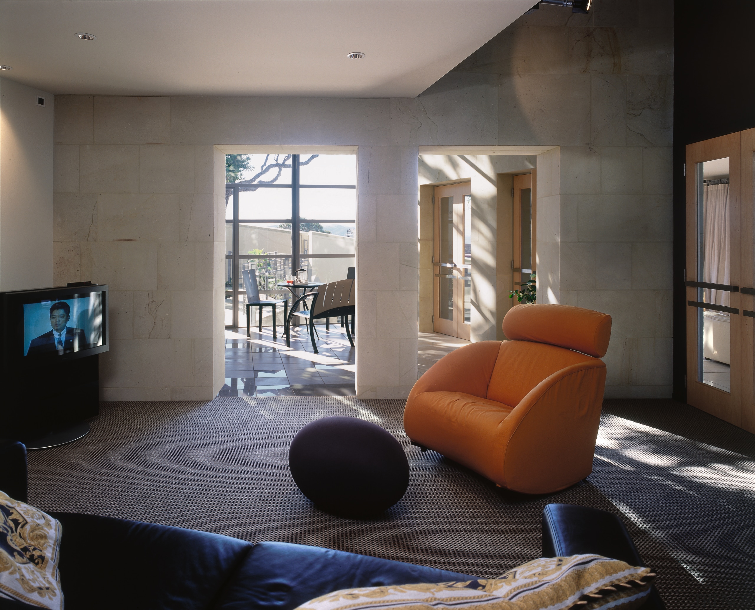 An interior view of the living areas featuring architecture, ceiling, floor, house, interior design, living room, property, real estate, room, window, gray, black