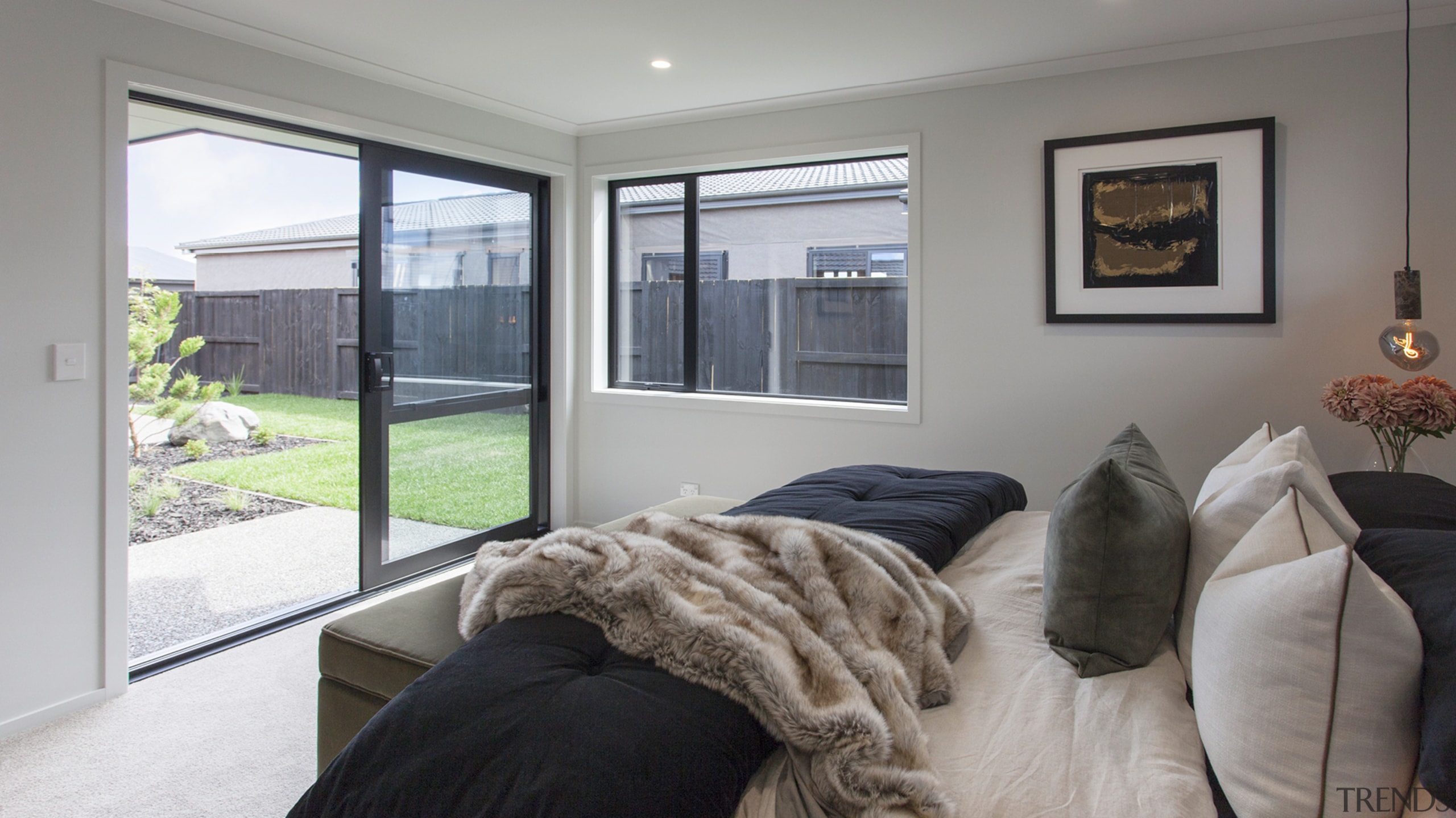 The master bedroom looks over the large lawn 