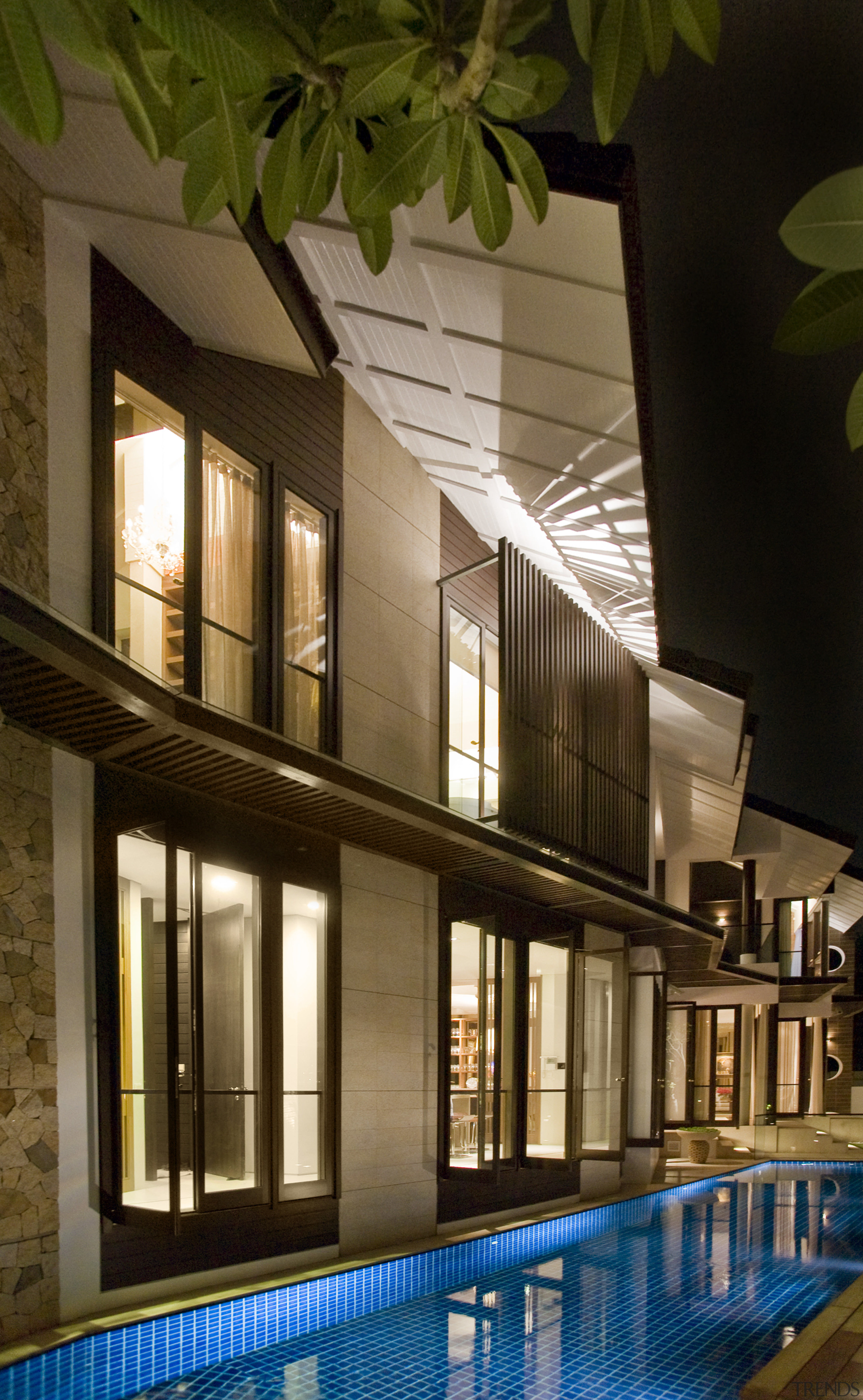 Exterior view of house which features a gabled apartment, architecture, building, condominium, estate, home, house, interior design, lighting, property, real estate, swimming pool, window, brown