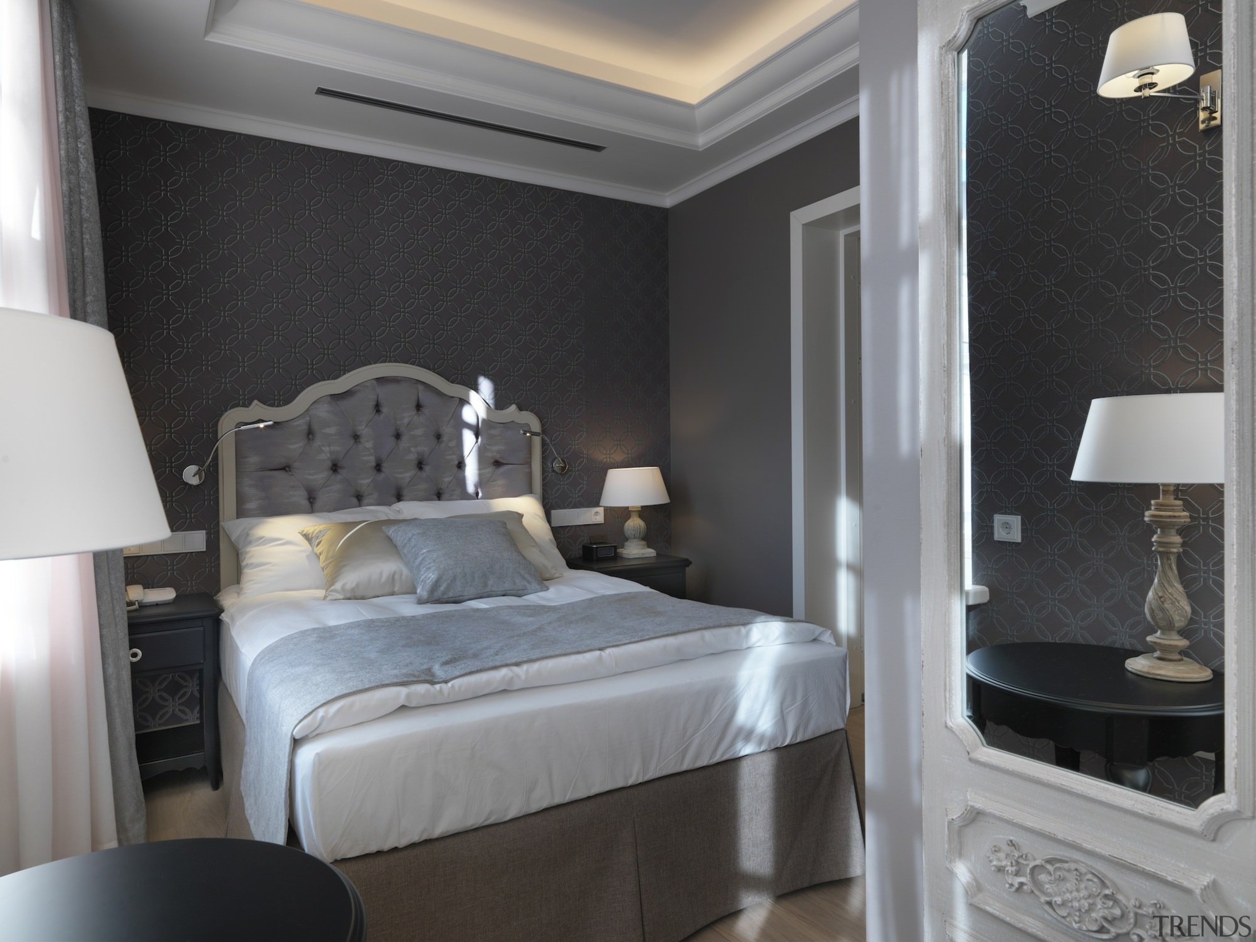 Elegant and contemporary touches line the hotel rooms bedroom, ceiling, interior design, room, suite, wall, gray, black