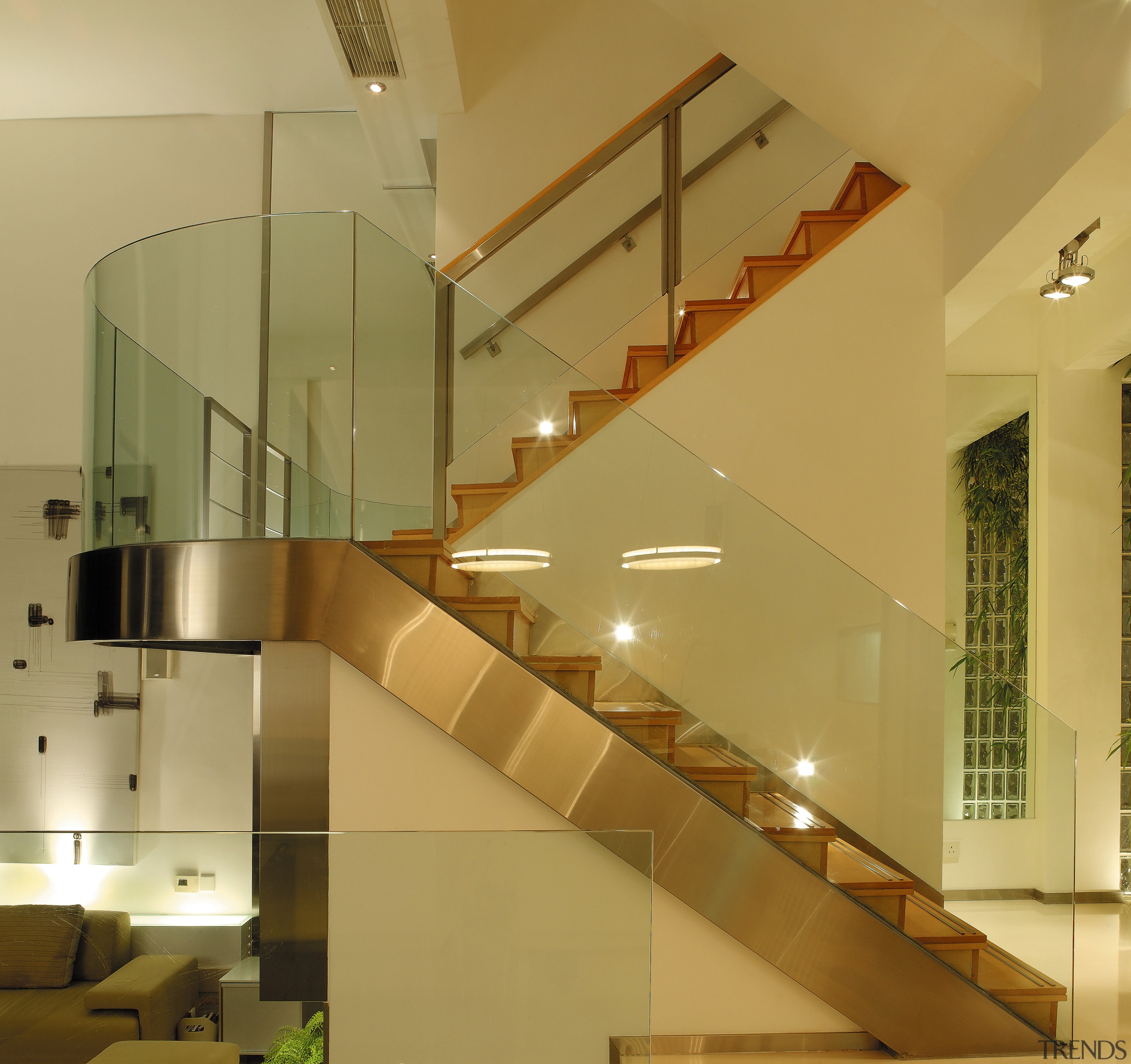 view of the interior of this house featuring architecture, ceiling, daylighting, glass, handrail, interior design, lobby, stairs, brown, orange