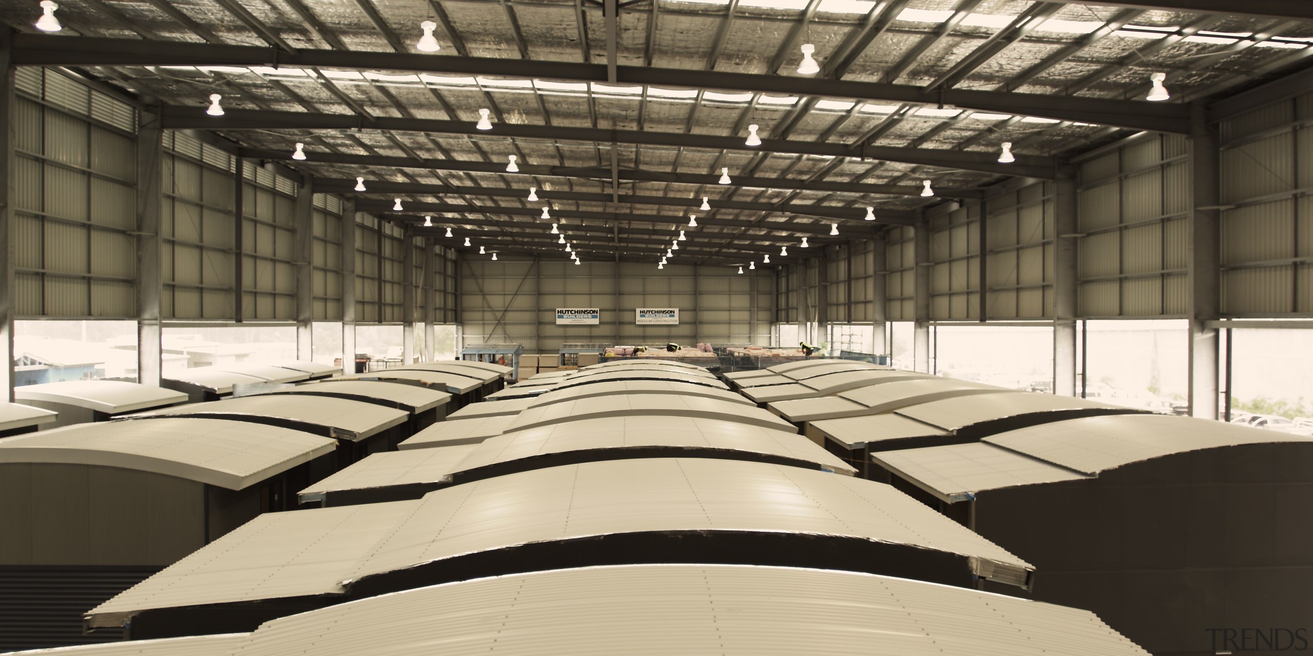 View of building by Hutchinson Builders. - View daylighting, steel, structure, black, orange
