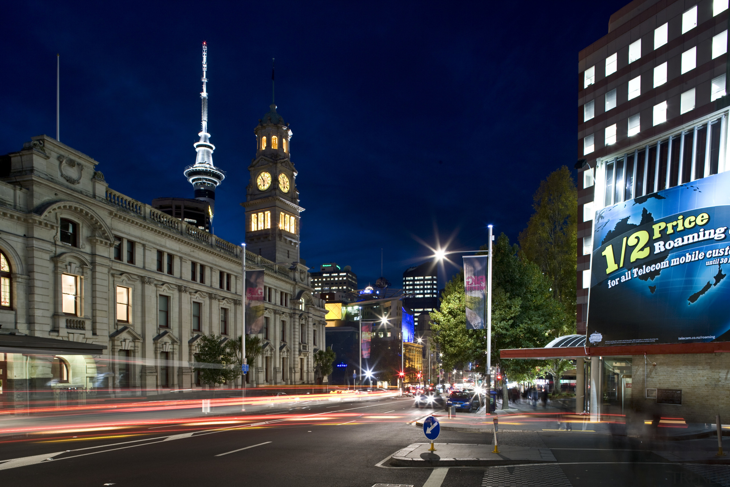 Image of historic buildings that have been refurbished building, car, city, cityscape, daytime, downtown, evening, infrastructure, landmark, metropolis, metropolitan area, night, plaza, road, sky, street, street light, tourist attraction, tower, town, town square, urban area, blue, black