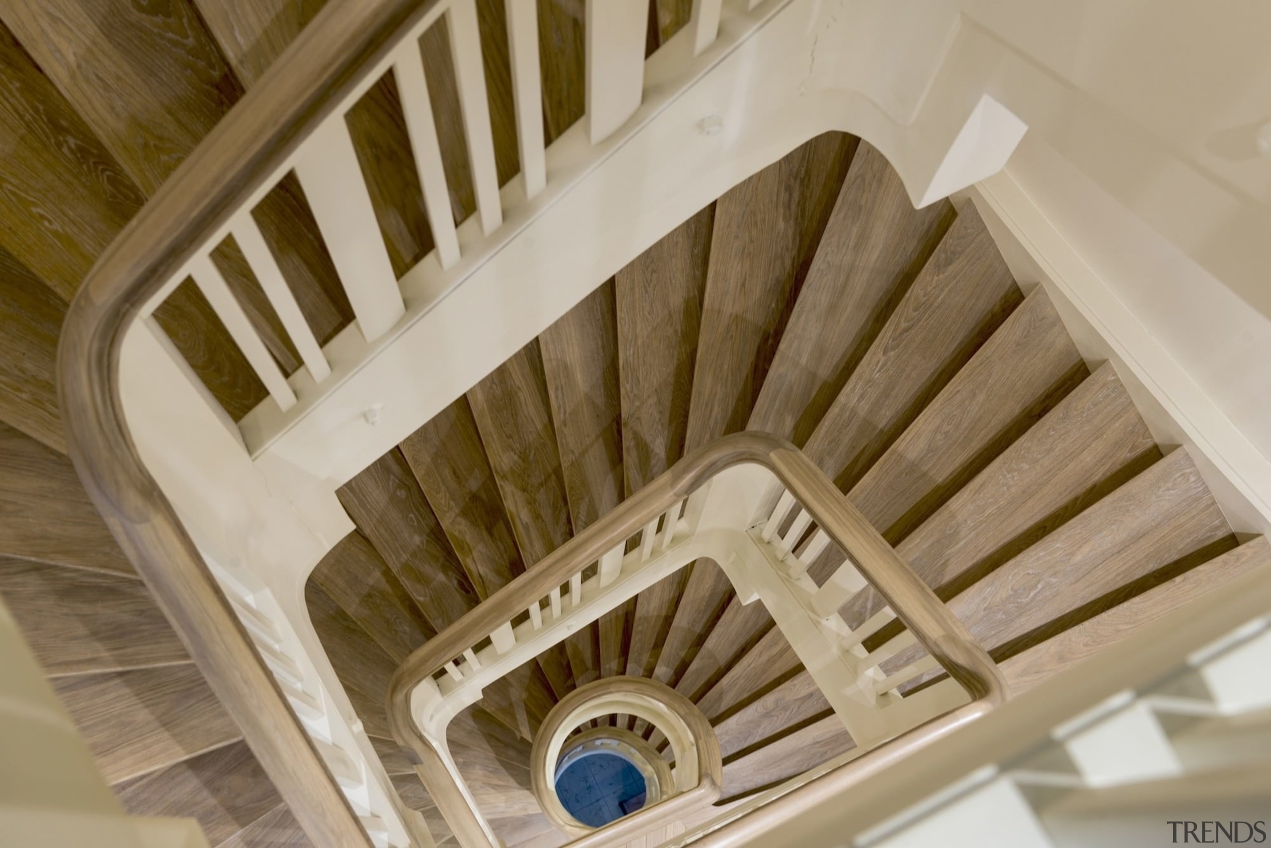 The original staircase has been brought into the architecture, baluster, ceiling, daylighting, stairs, structure, wood, brown, gray
