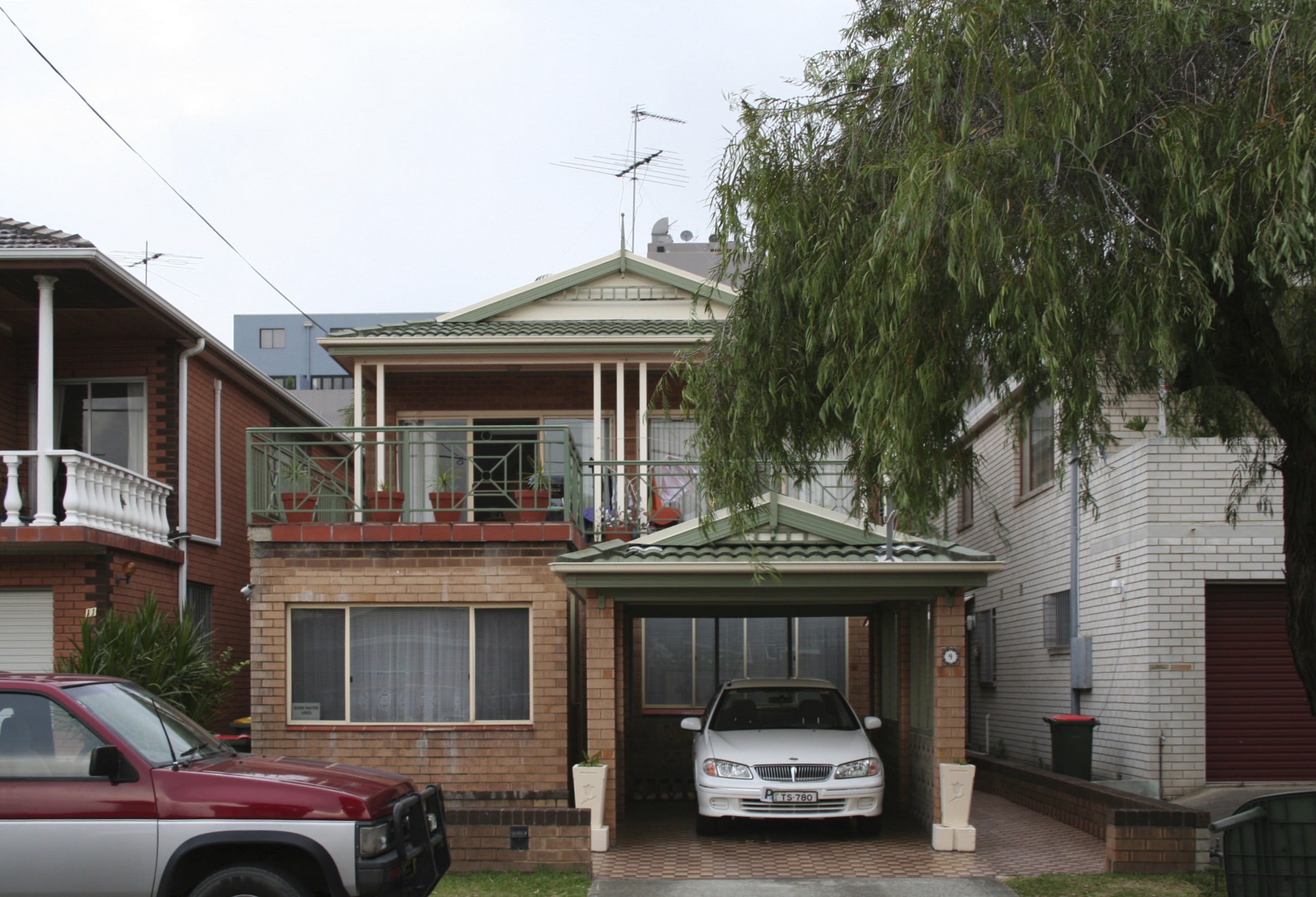 Before picture of a house. - Before picture building, car, facade, family car, home, house, luxury vehicle, neighbourhood, property, real estate, residential area, roof, sedan, suburb, vehicle