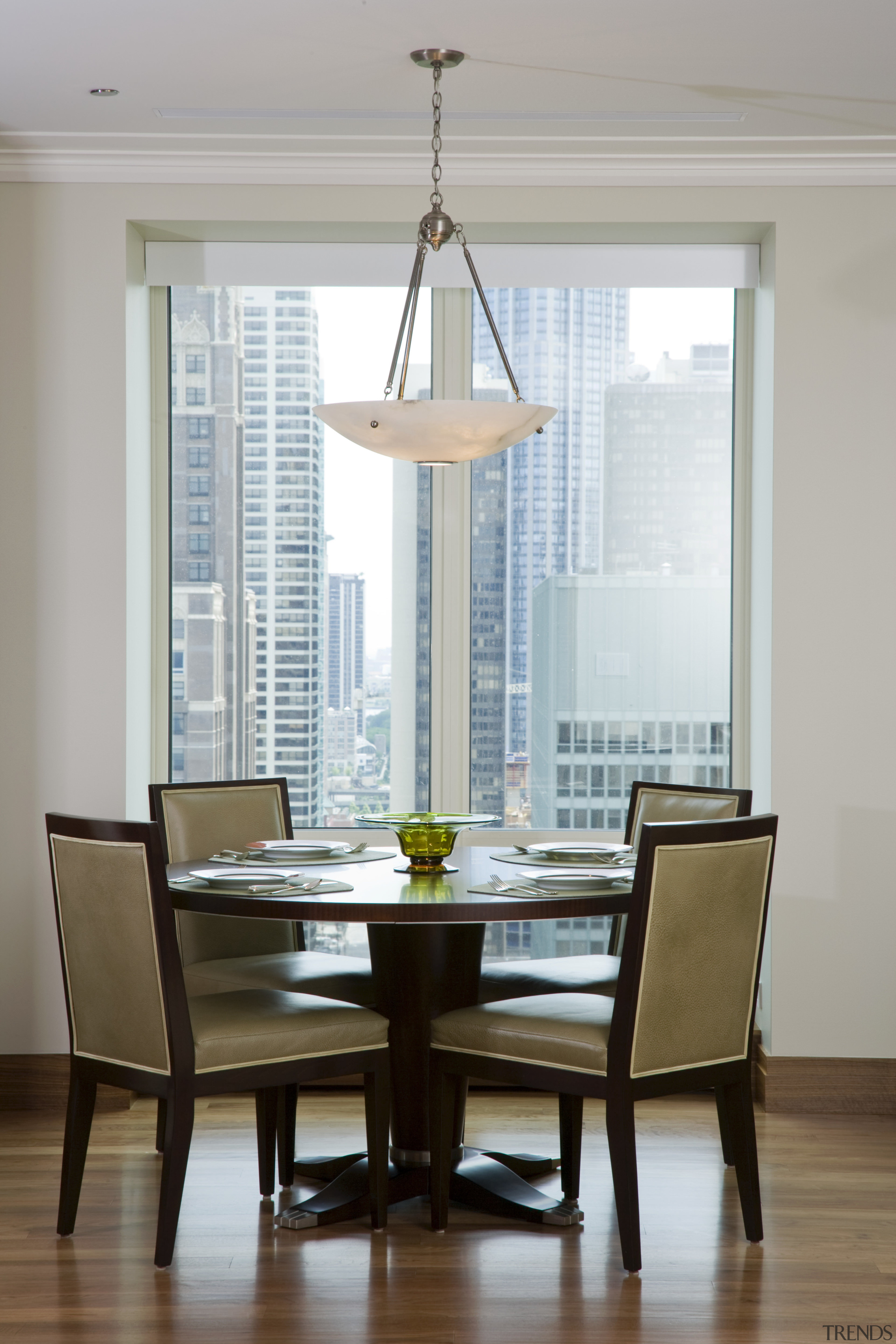 The casual dining area is positioned by the chair, dining room, furniture, home, interior design, living room, room, table, window, window covering, gray