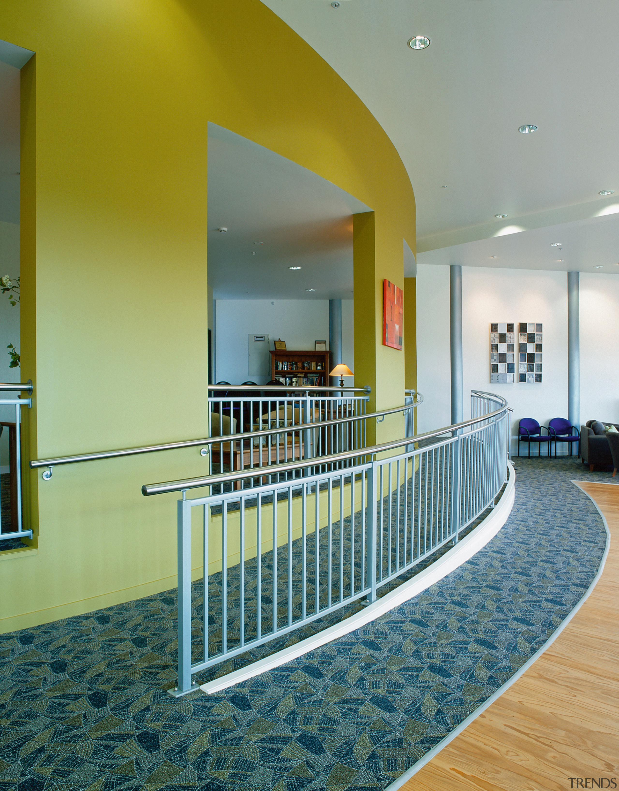 Internal view of building with ramps to split condominium, estate, floor, flooring, handrail, interior design, leisure centre, lobby, real estate, gray