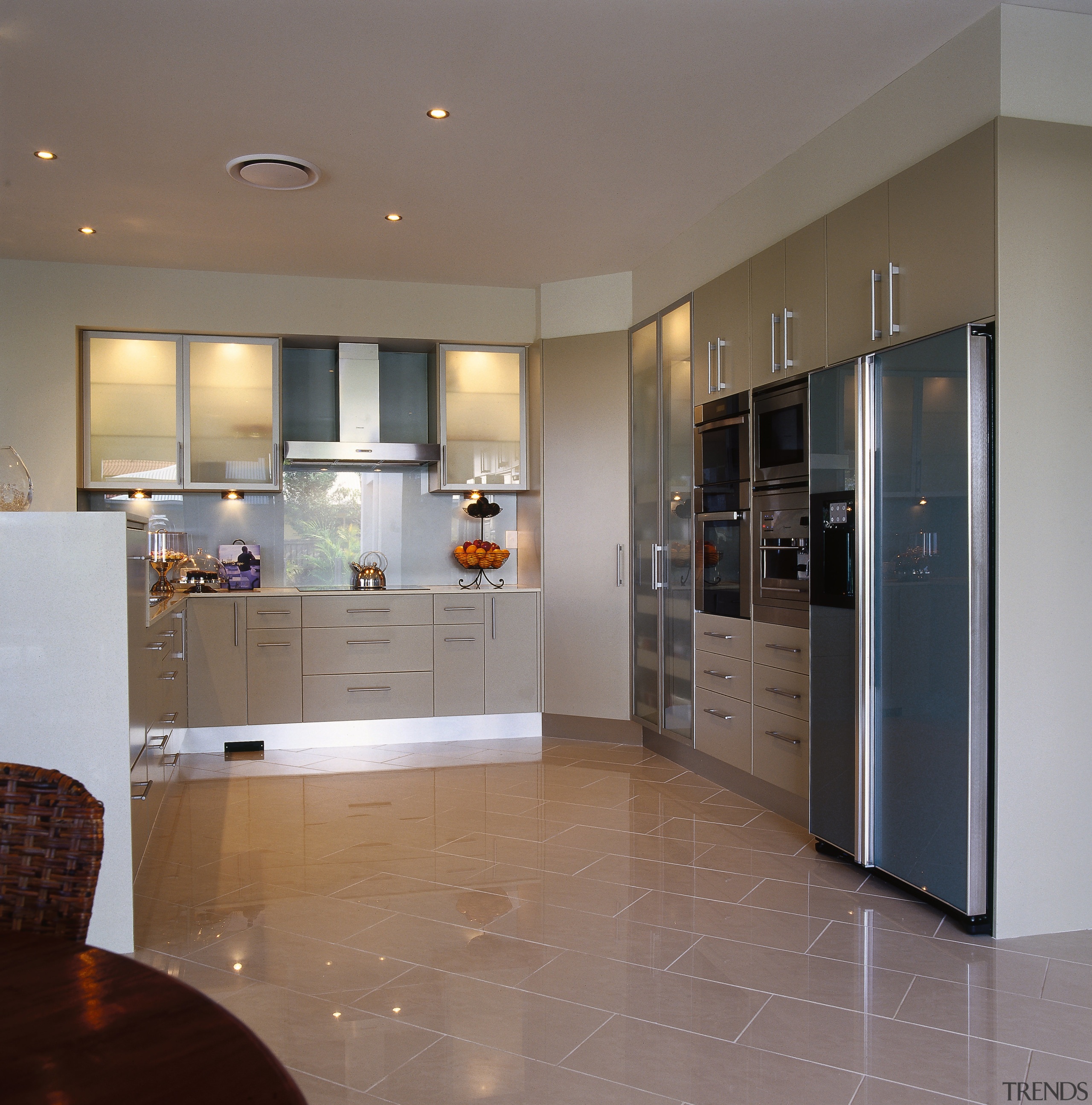 view of this clean lined kitchen with tranluscent cabinetry, countertop, floor, flooring, home appliance, interior design, kitchen, room, gray