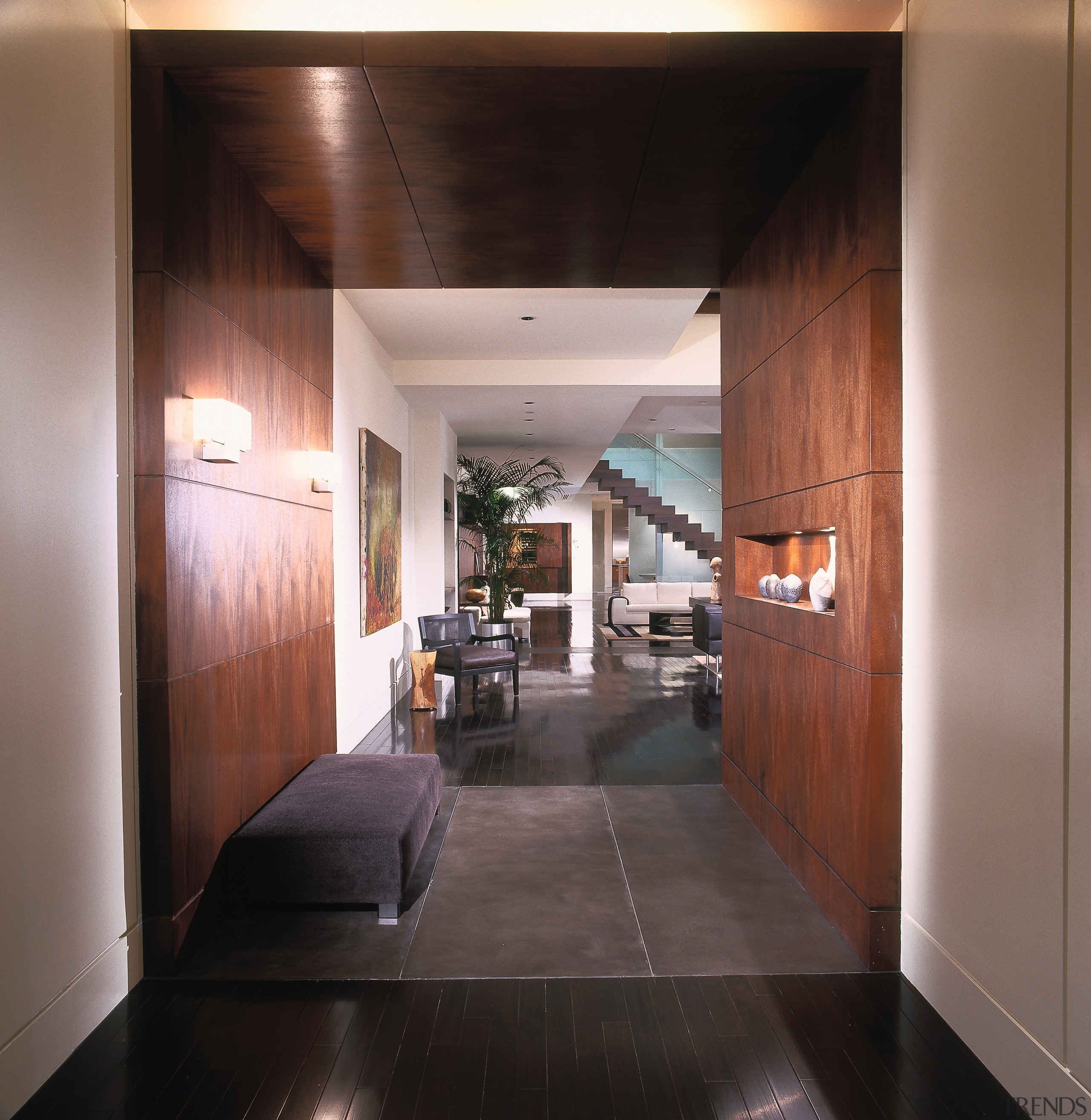 A view of a hallway, wooden flooring and architecture, ceiling, floor, flooring, interior design, lobby, black, gray