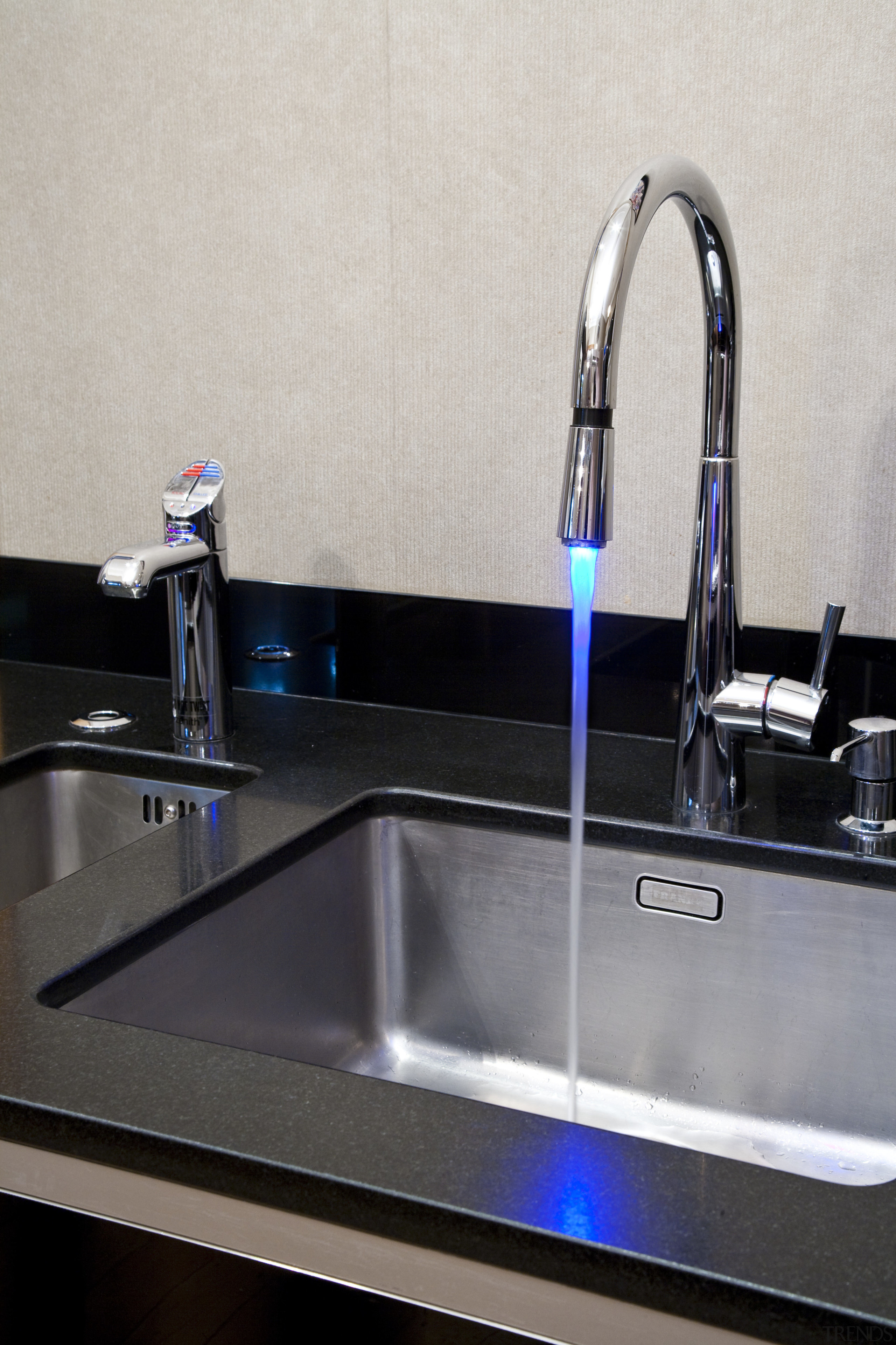 View of contemporary kitchen with dark cabinets and bathroom sink, glass, plumbing fixture, product design, sink, tap, gray, black