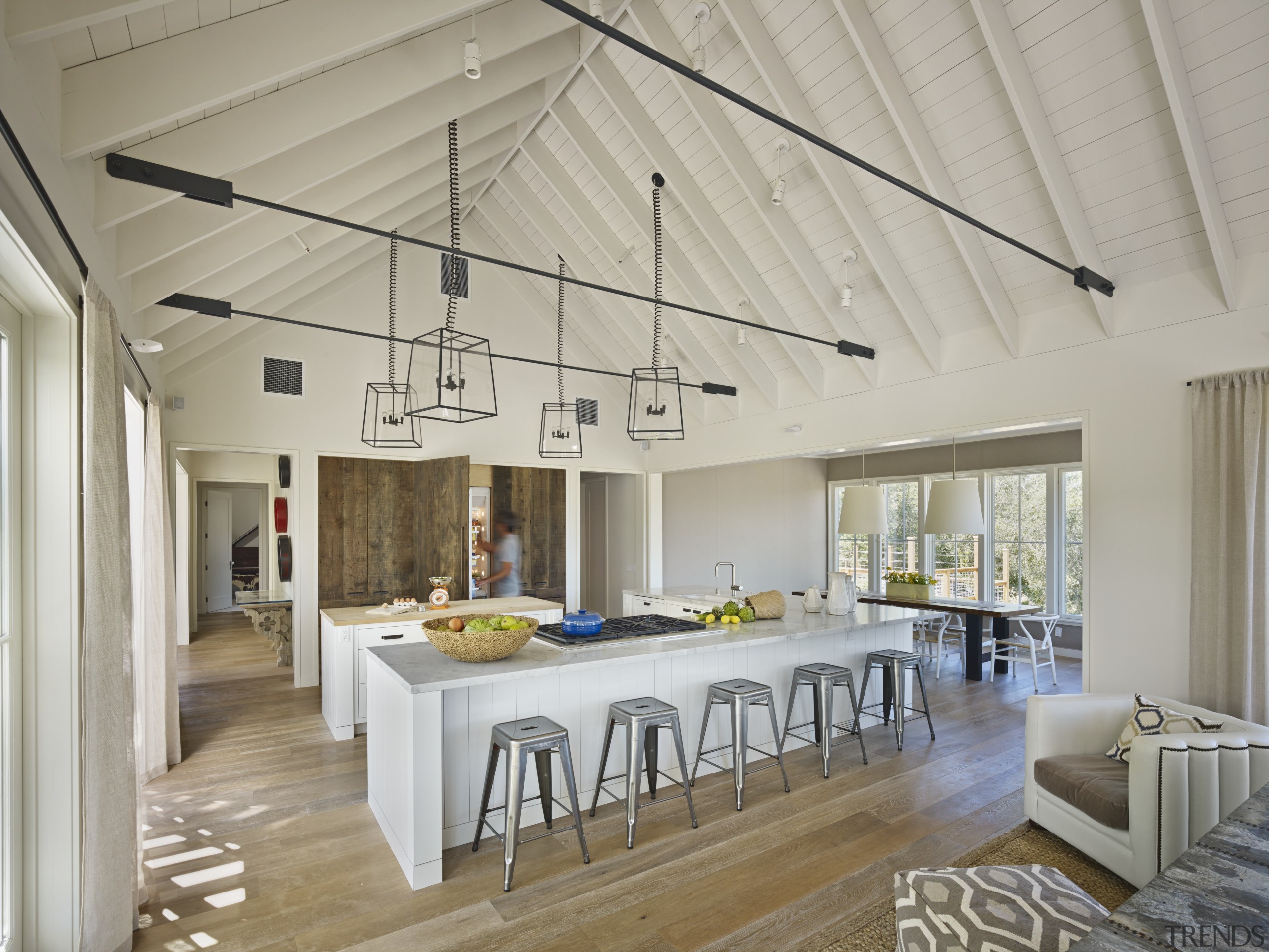 The kitchen in this country house is positioned ceiling, daylighting, interior design, real estate, roof, gray