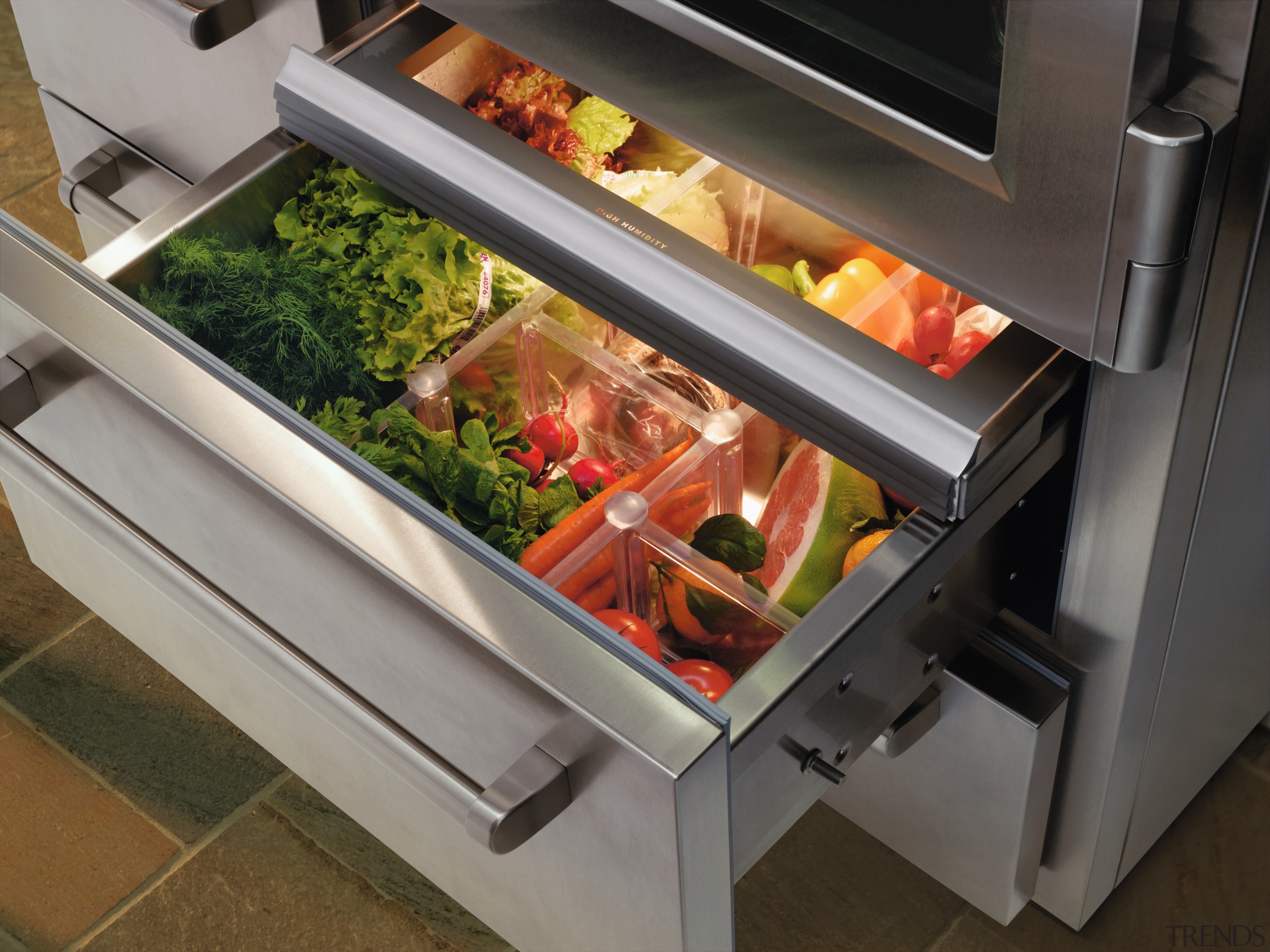 A view of the inside of the fridge. food, kitchen appliance, gray, black