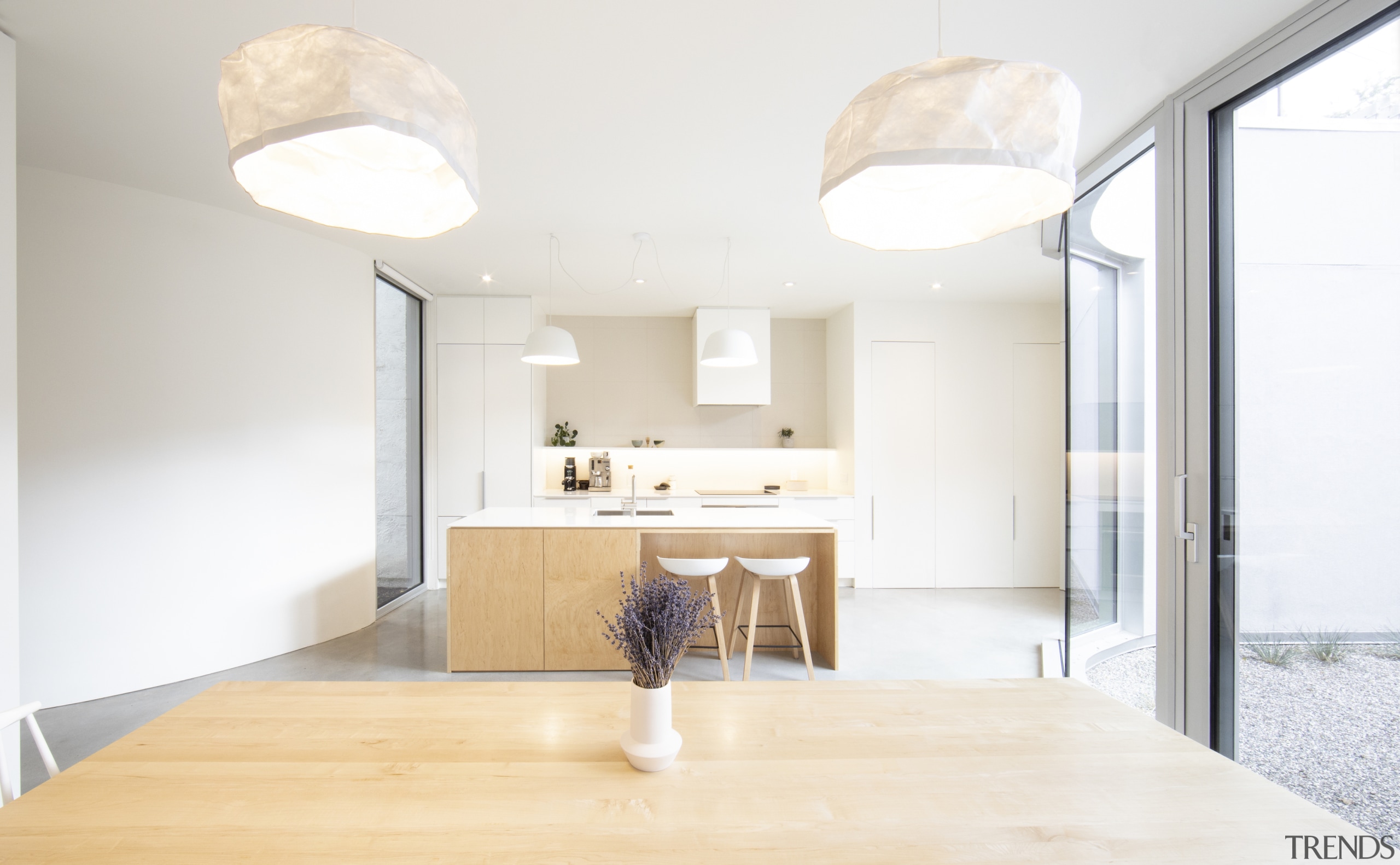 The curved wall to the left responds to 