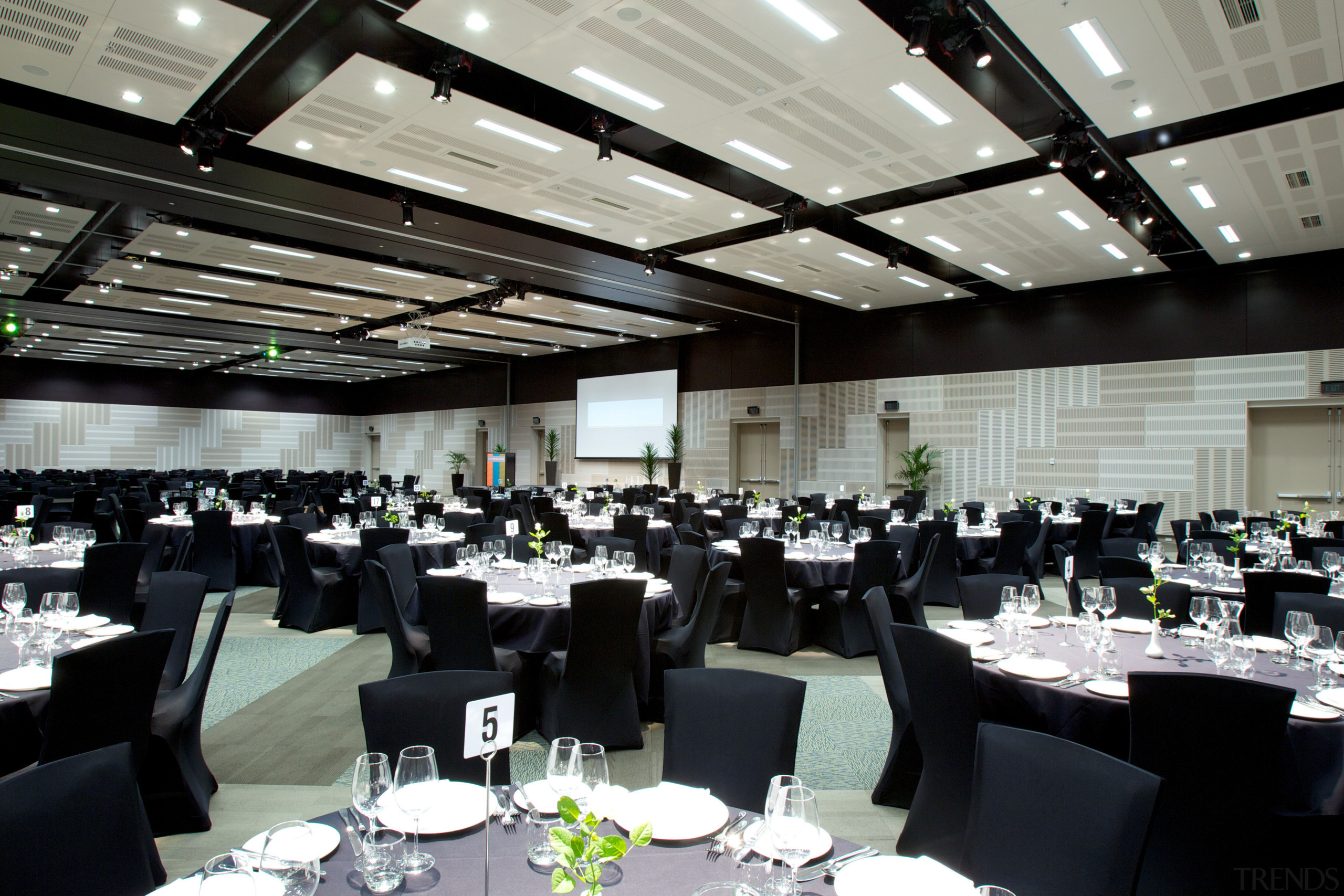 The Claudelands arena was redesigned by Chow of banquet, conference hall, convention, function hall, restaurant, black, gray