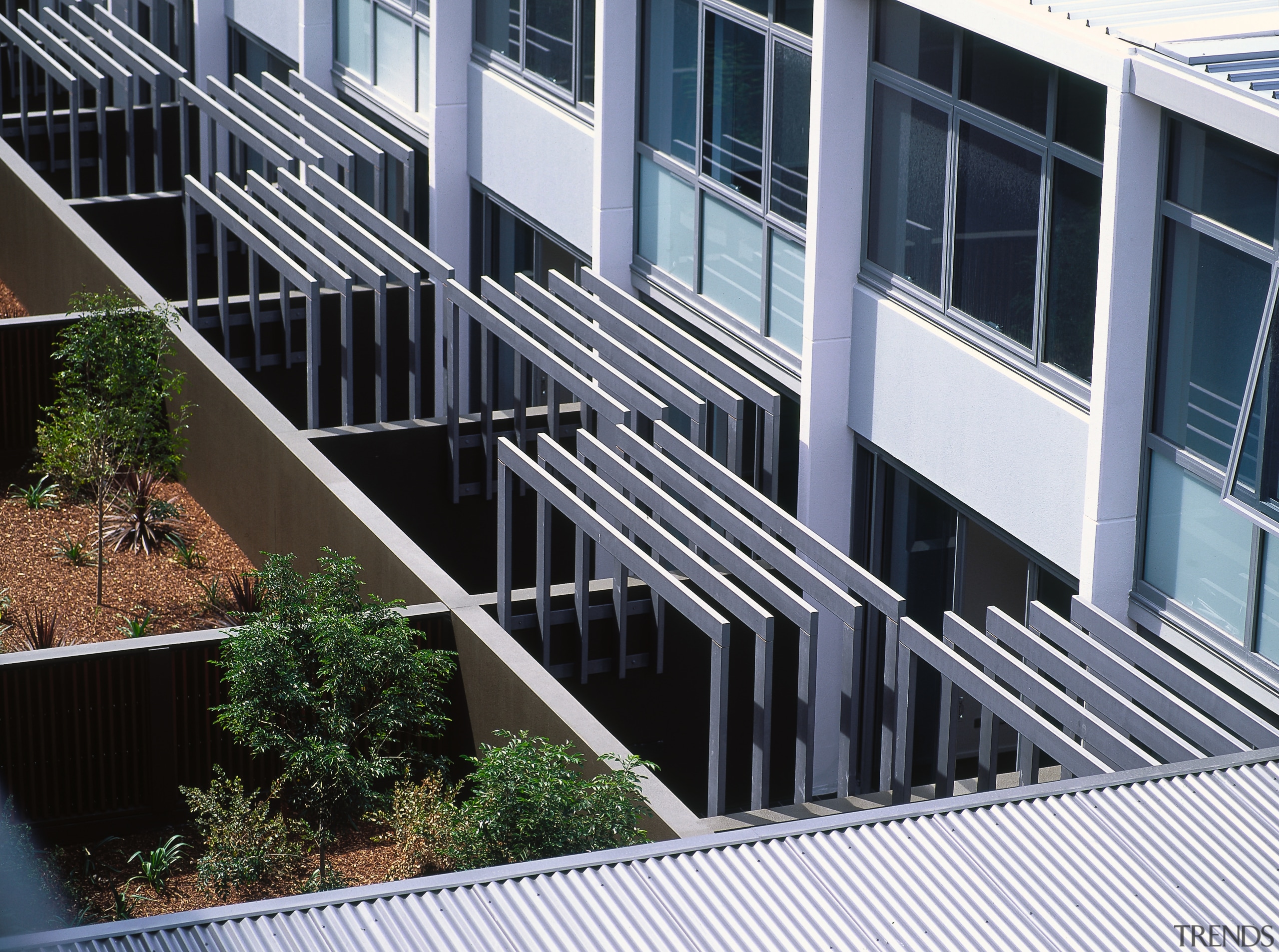 A view of some louvres. - A view architecture, building, condominium, facade, handrail, house, mixed use, real estate, residential area, siding, window, black, gray