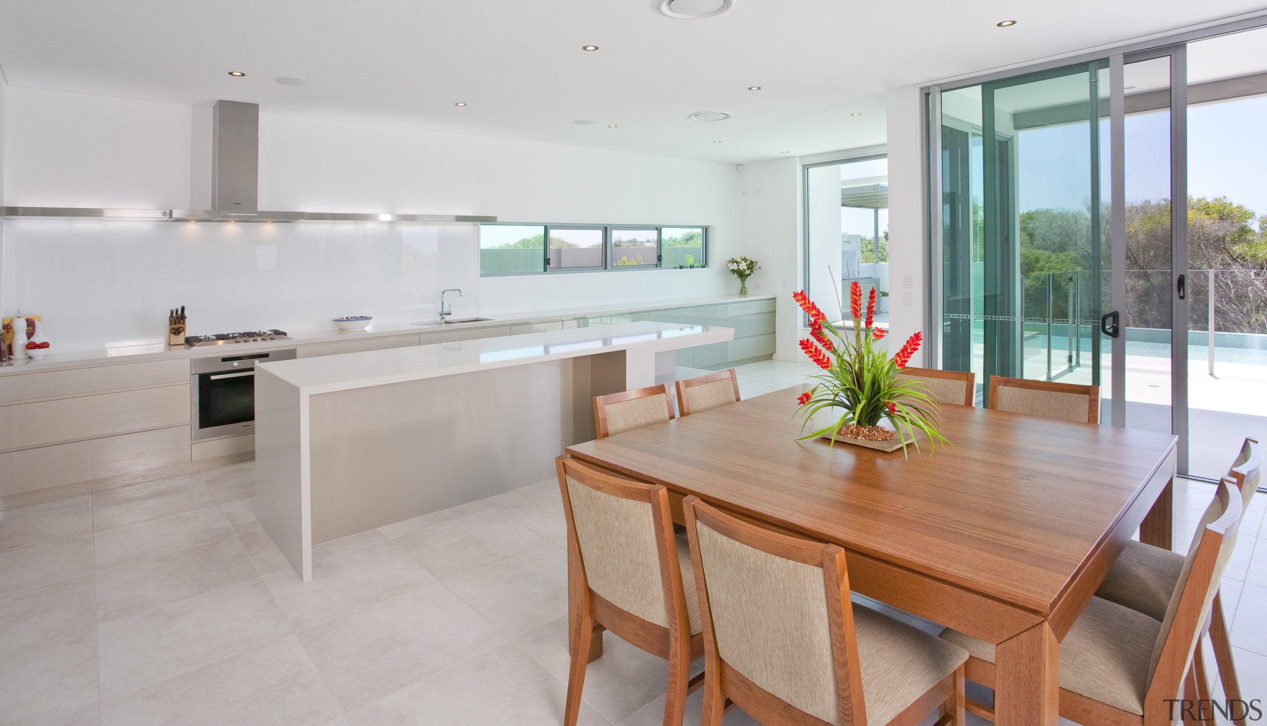 View of a kitchen and dining area which architecture, countertop, floor, house, interior design, kitchen, property, real estate, room, gray