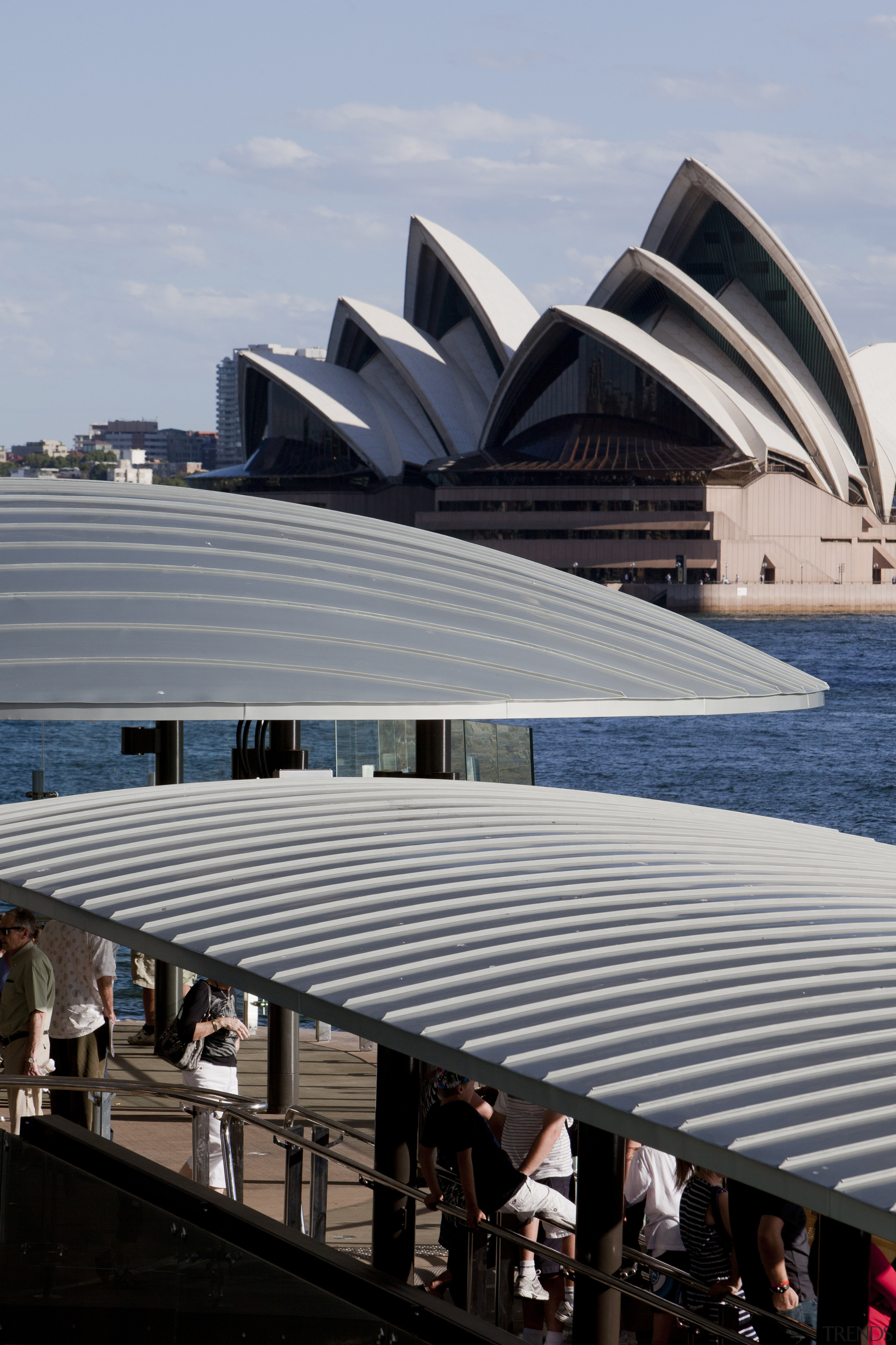 Seen here is a new building on the architecture, building, daylighting, opera house, roof, sky, structure, water, gray, black