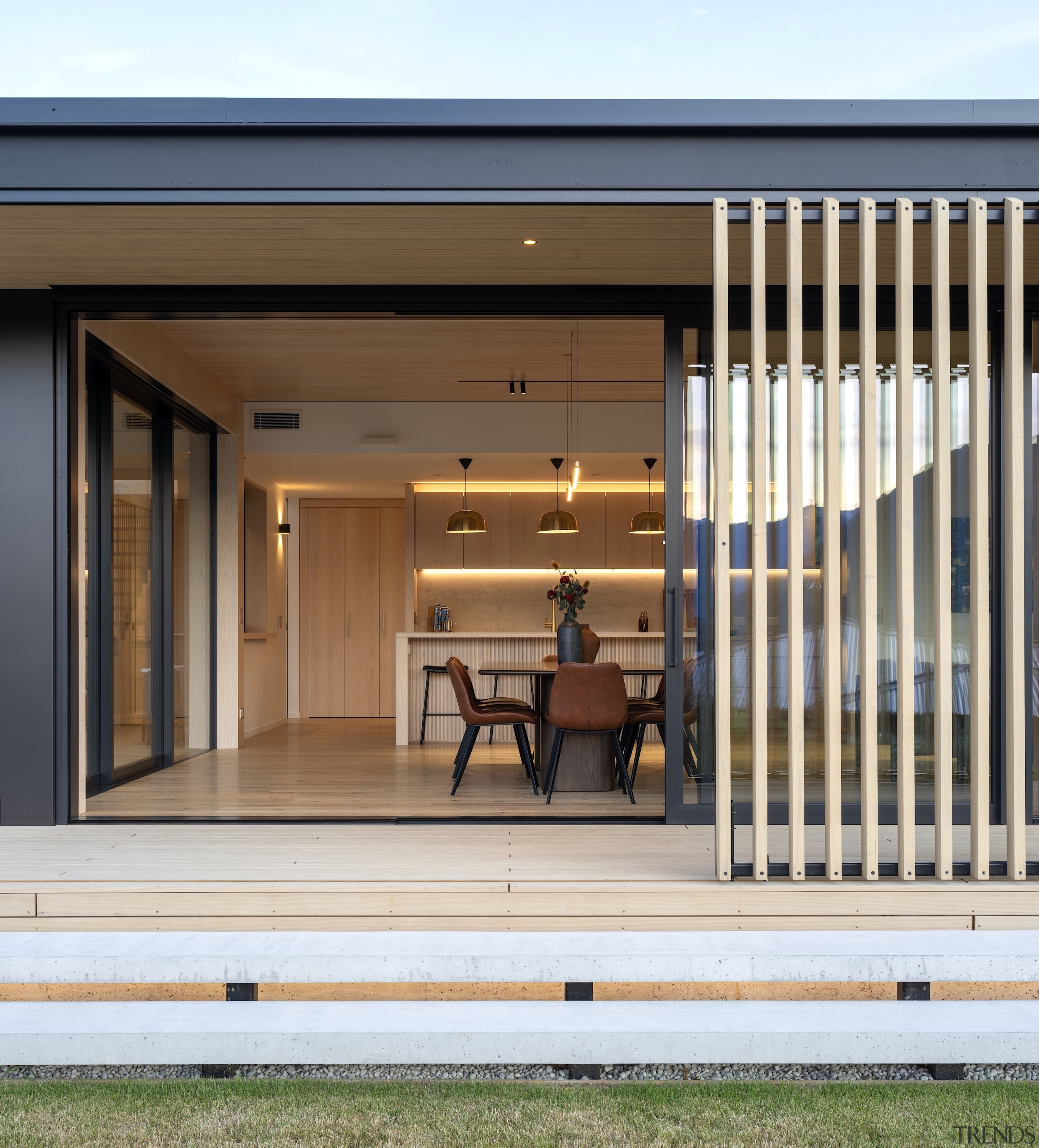 Verandah with dining and kitchen behind. - 'Hygge' 