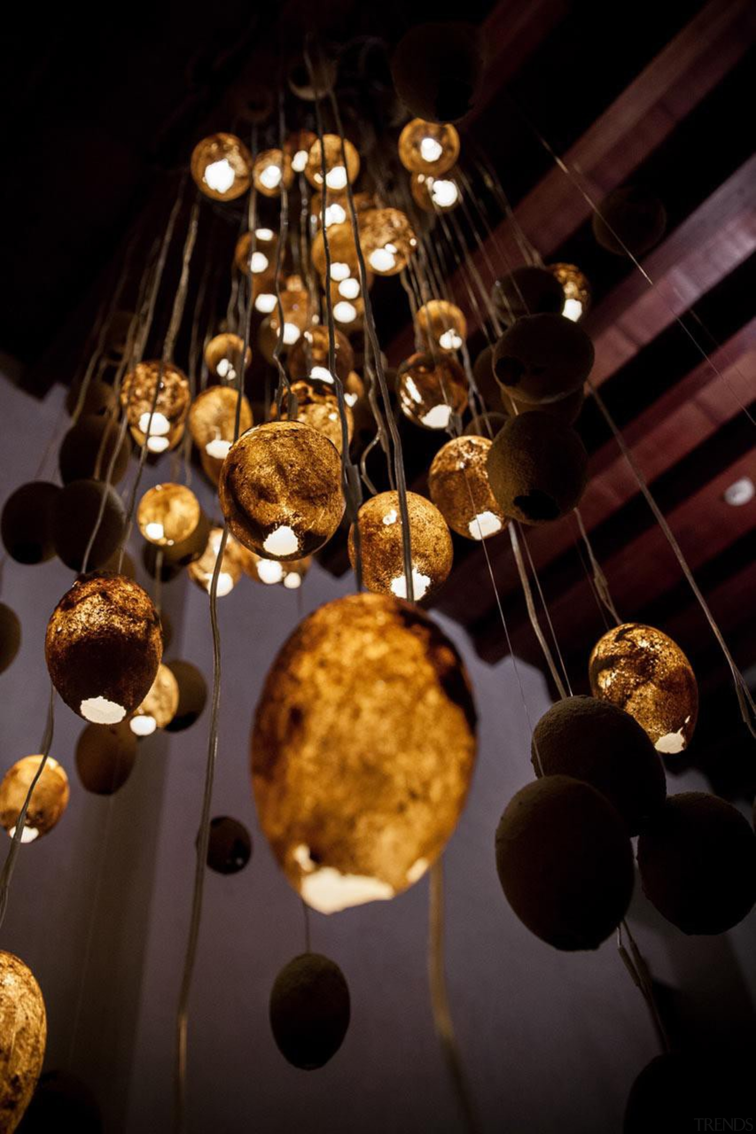 The Tranquility Nodes made from sand are packed light fixture, lighting, black