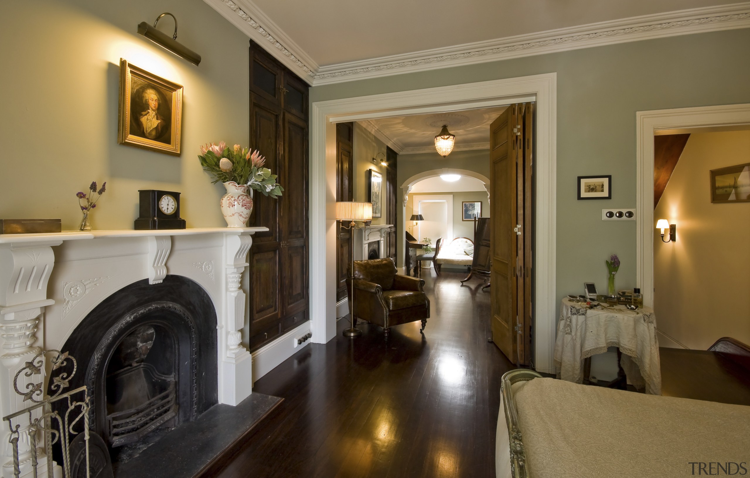 In this restored Victorian terrace a wall separating estate, home, interior design, living room, property, real estate, room, suite, brown