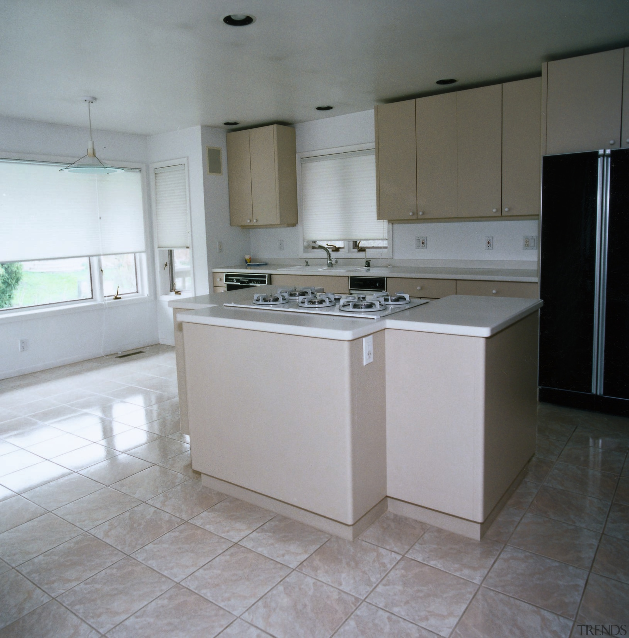 View of the kitchen area - View of cabinetry, countertop, floor, interior design, kitchen, property, real estate, room, sink, gray