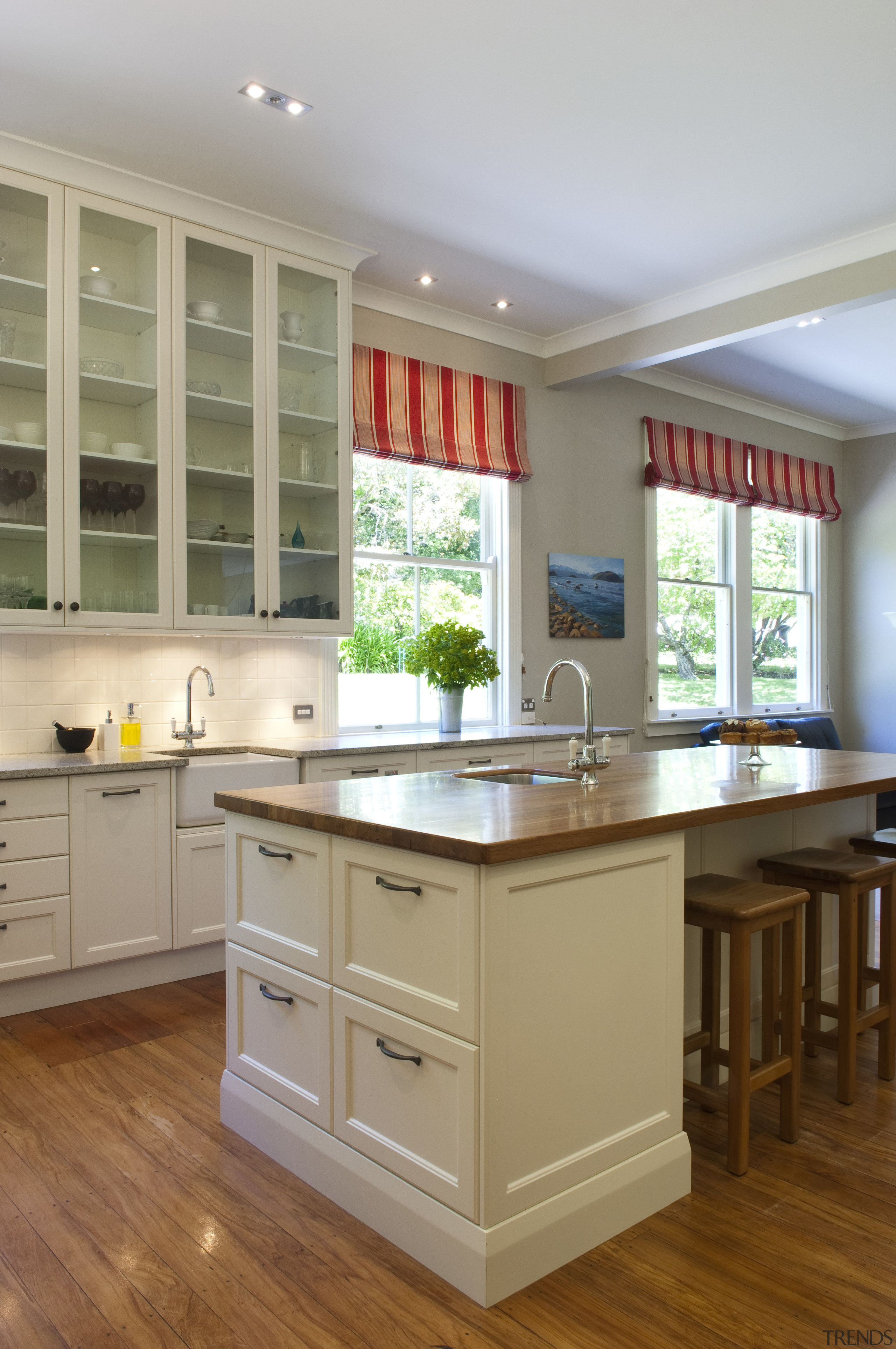 View of contemporary kitchen with wooden flooring and cabinetry, countertop, cuisine classique, floor, flooring, hardwood, interior design, kitchen, room, window, wood flooring, gray, brown