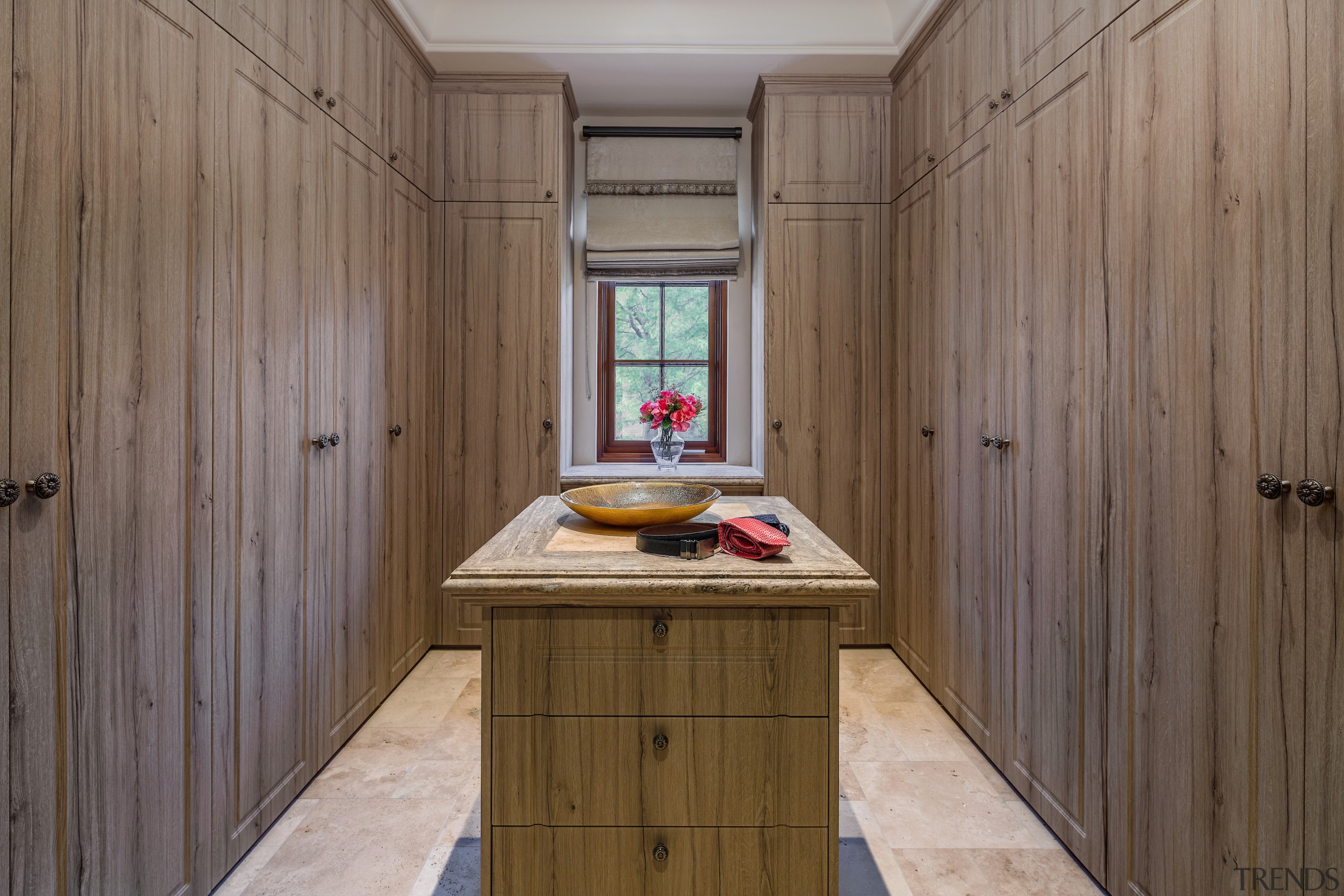 Dressing room with walls of built-in storage. 