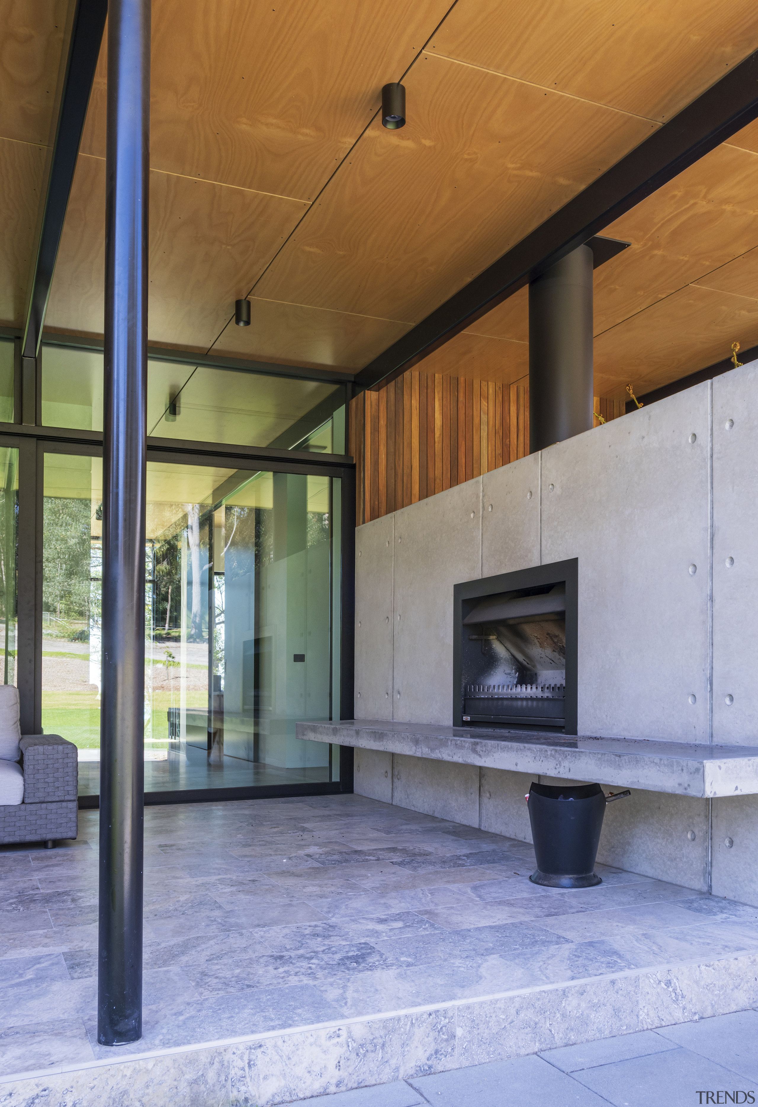 Sheltered outdoor living comes with an outdoor fireplace. 