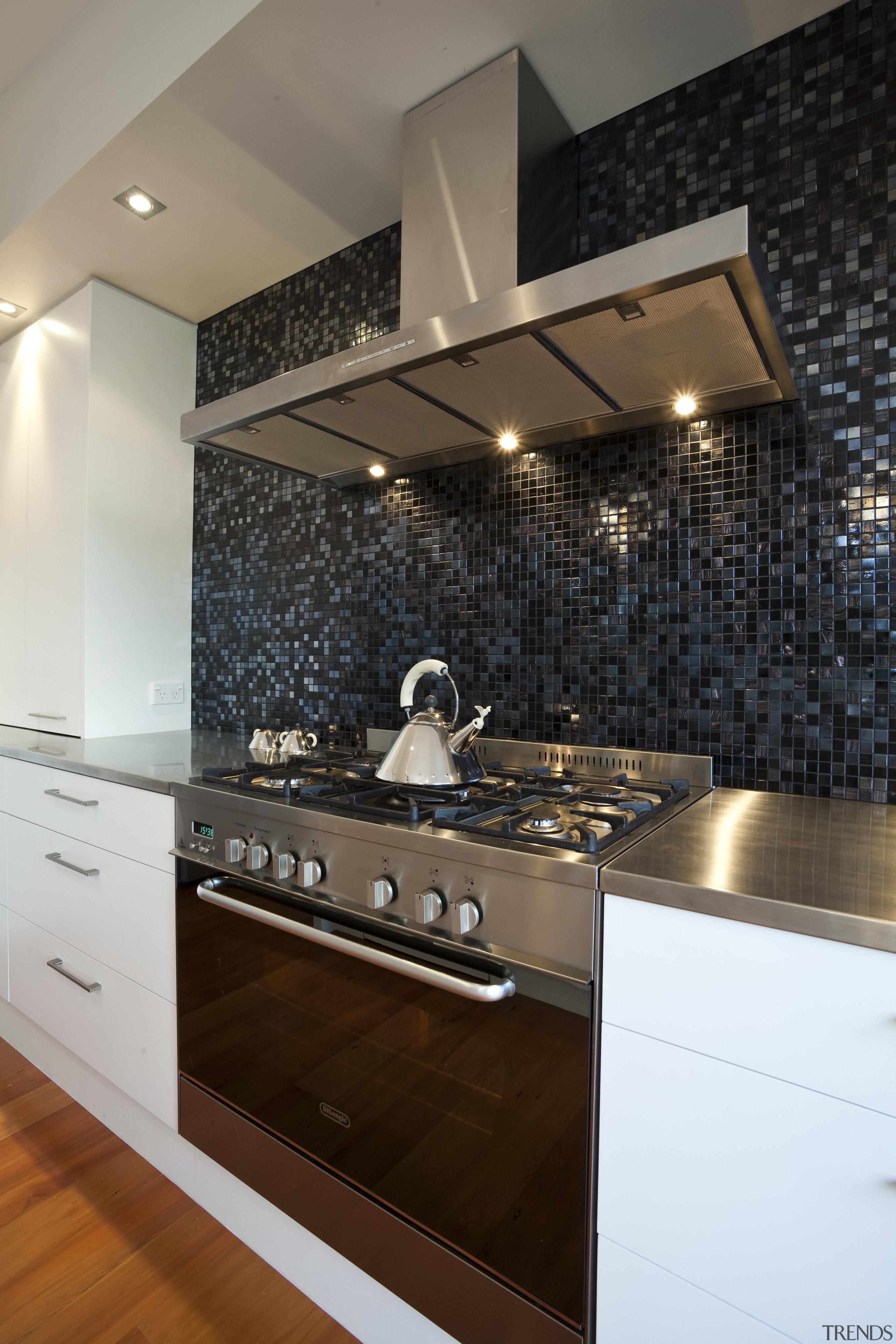 Kitchen designed by Yellow Fox, manufactured by Quality ceiling, countertop, flooring, interior design, kitchen, room, under cabinet lighting, black, brown