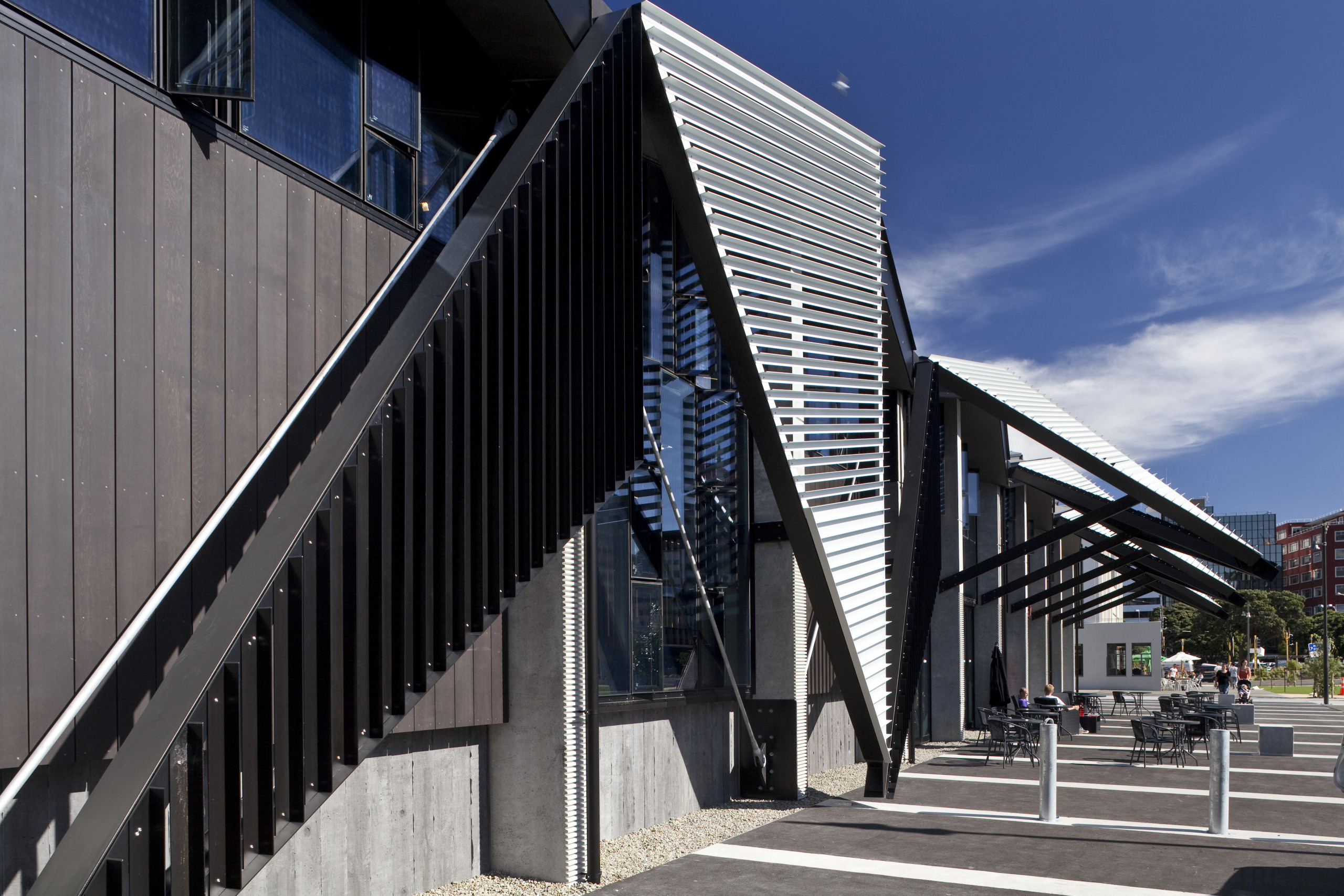 View of folded roof and canopy design at architecture, building, corporate headquarters, facade, house, landmark, structure, black, gray