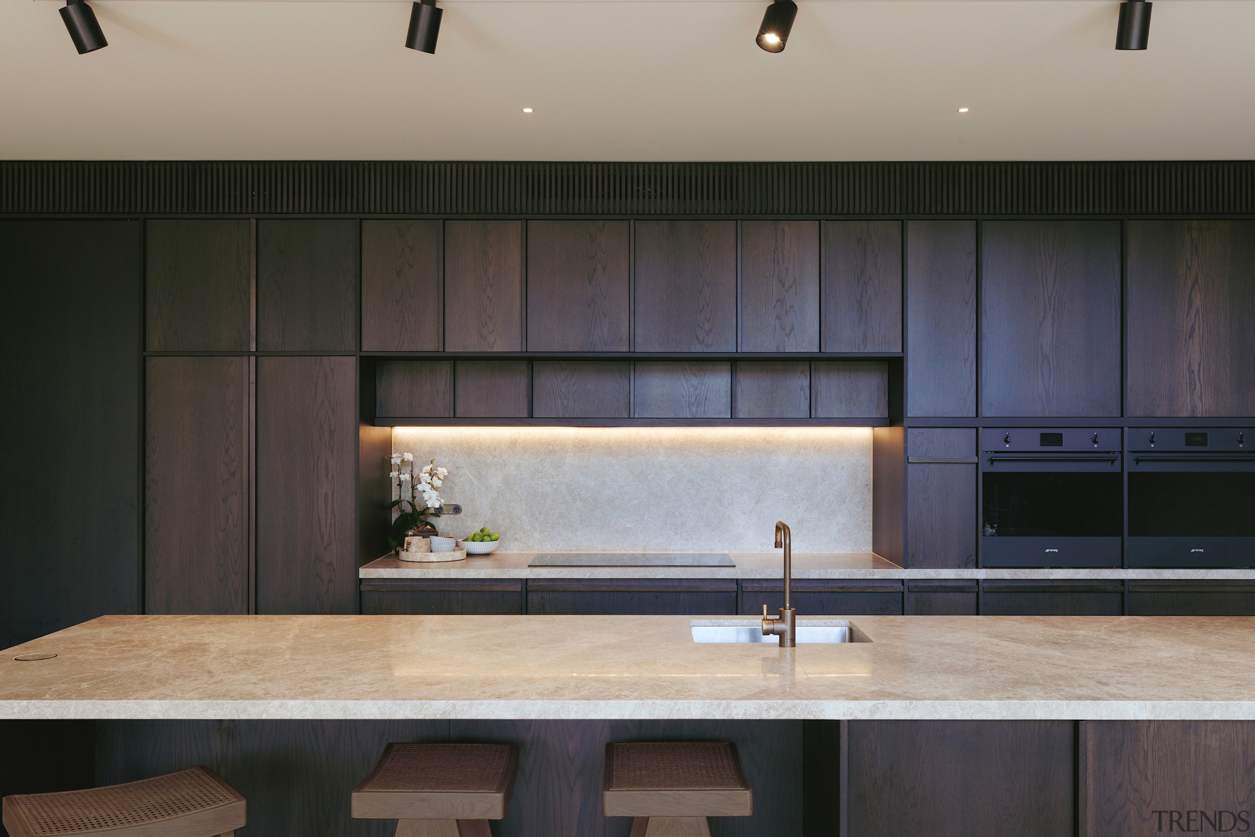 The strong yet pared back kitchen design. - 