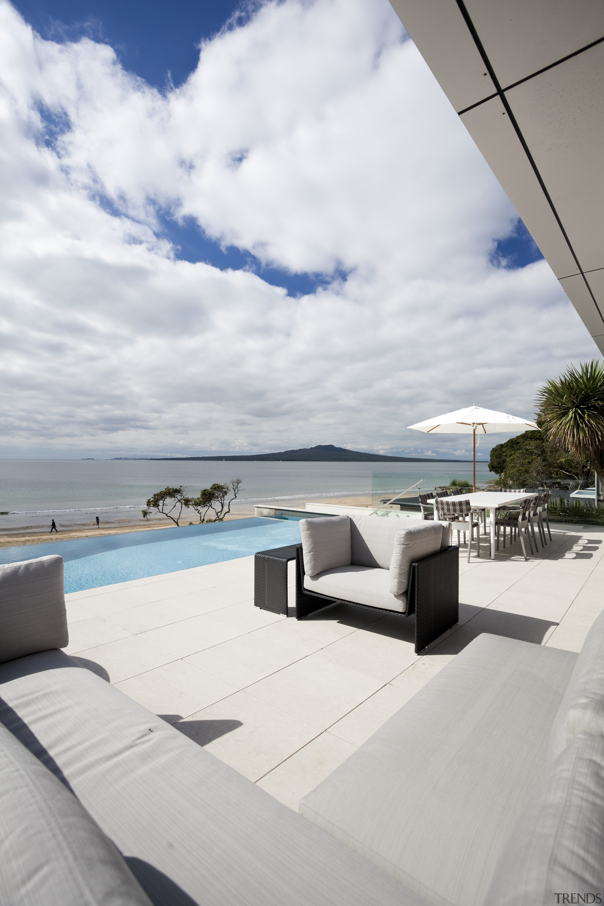 View of beach and pool from house. - boat, deck, estate, ocean, outdoor furniture, property, real estate, sea, sky, sunlounger, swimming pool, vacation, yacht, gray, white