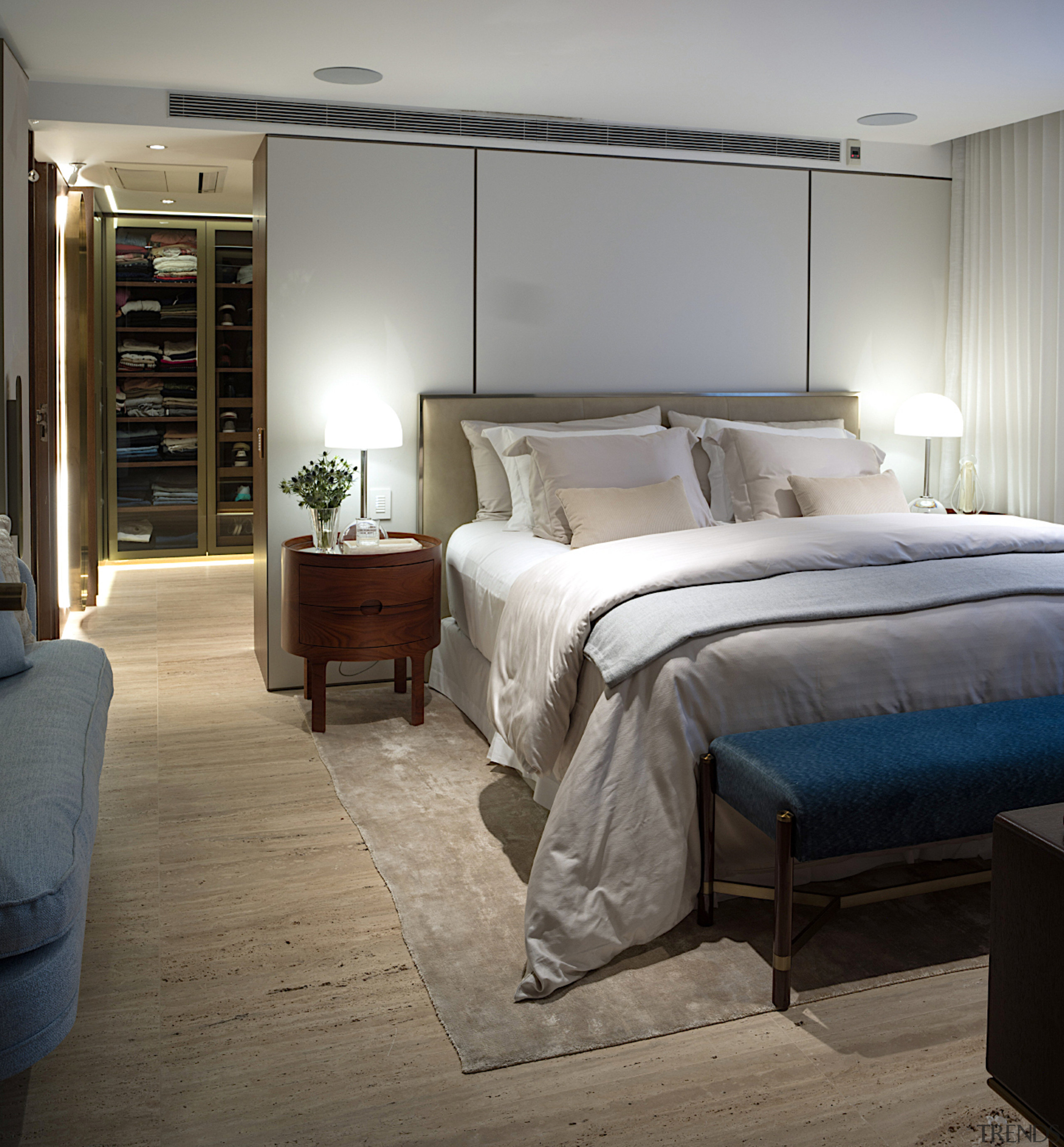 Master bedroom with glass cabinet peeking through from 