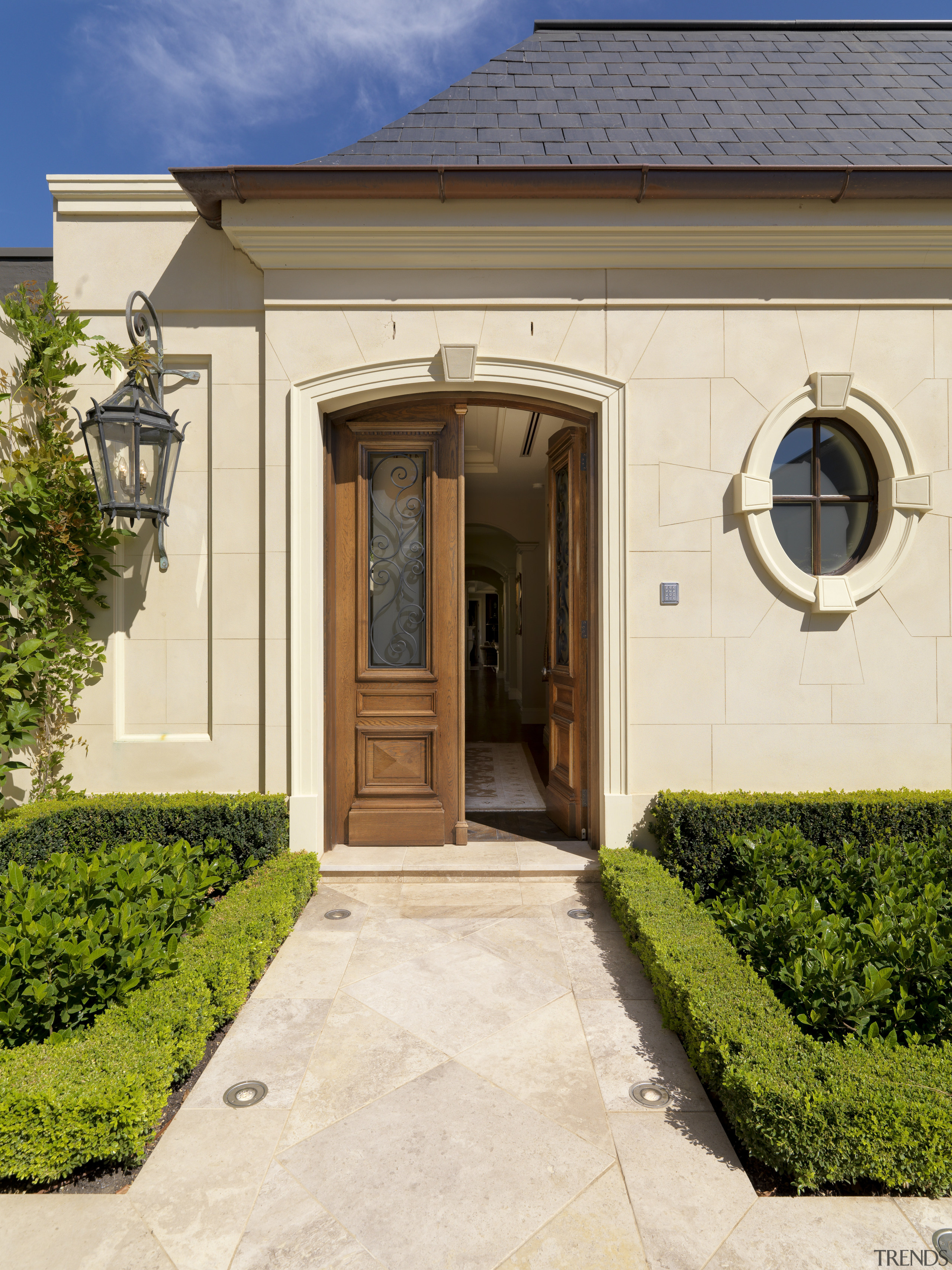 Entrance to this traditional home - Entrance to door, estate, facade, home, house, property, real estate, siding, window, orange, brown