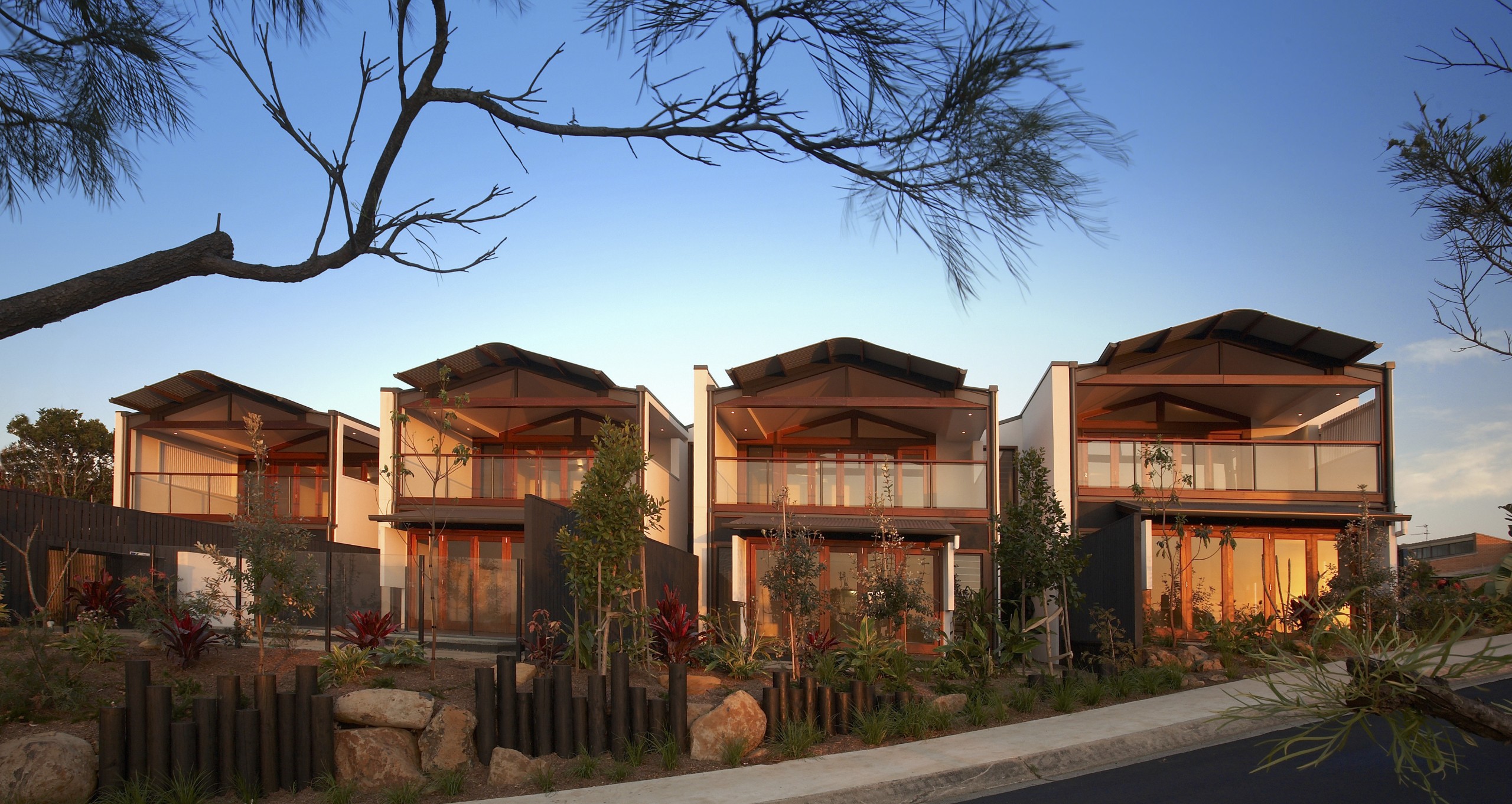 Exterior view of the Seagrass Villas which were estate, facade, home, house, property, real estate, residential area, roof, sky, brown, teal