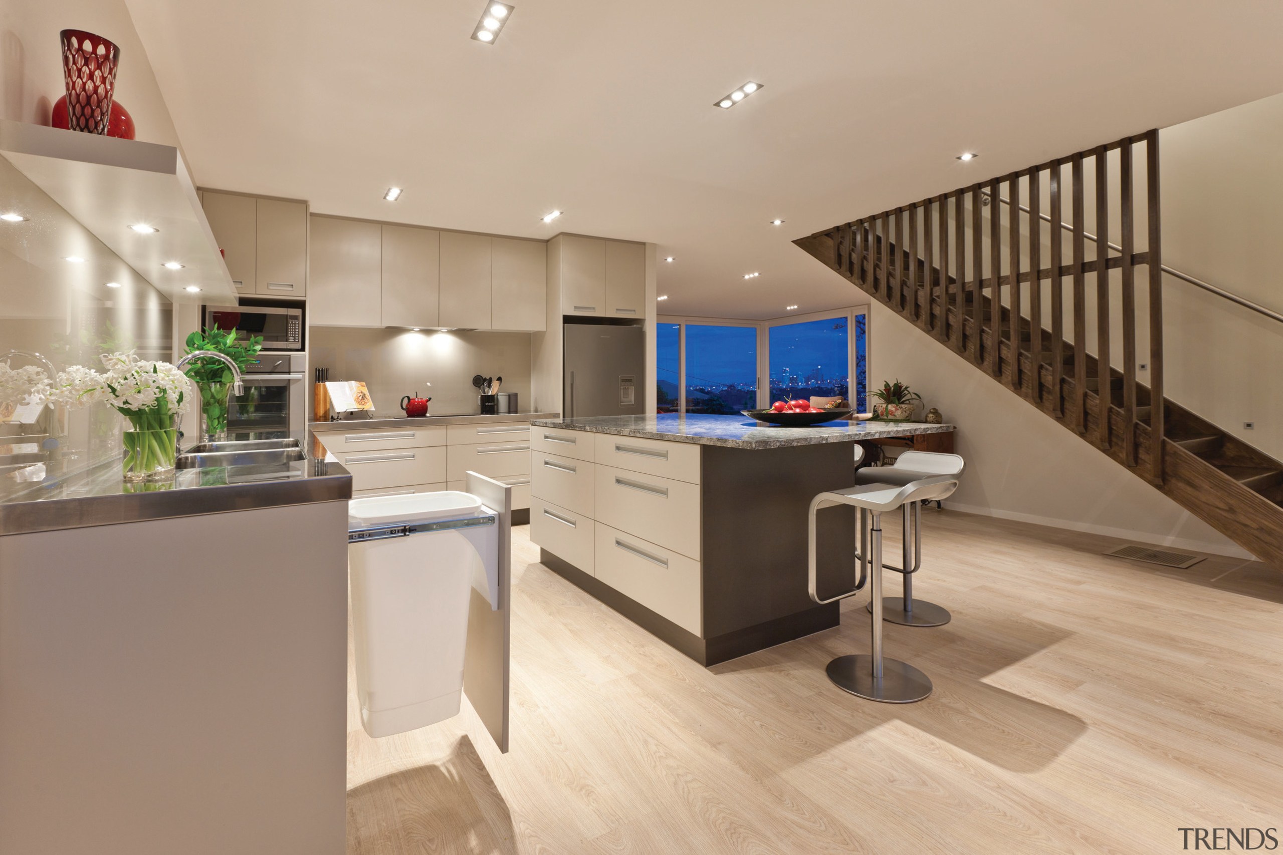 View of a large open-plan kitchen which features countertop, floor, interior design, kitchen, real estate, orange, brown