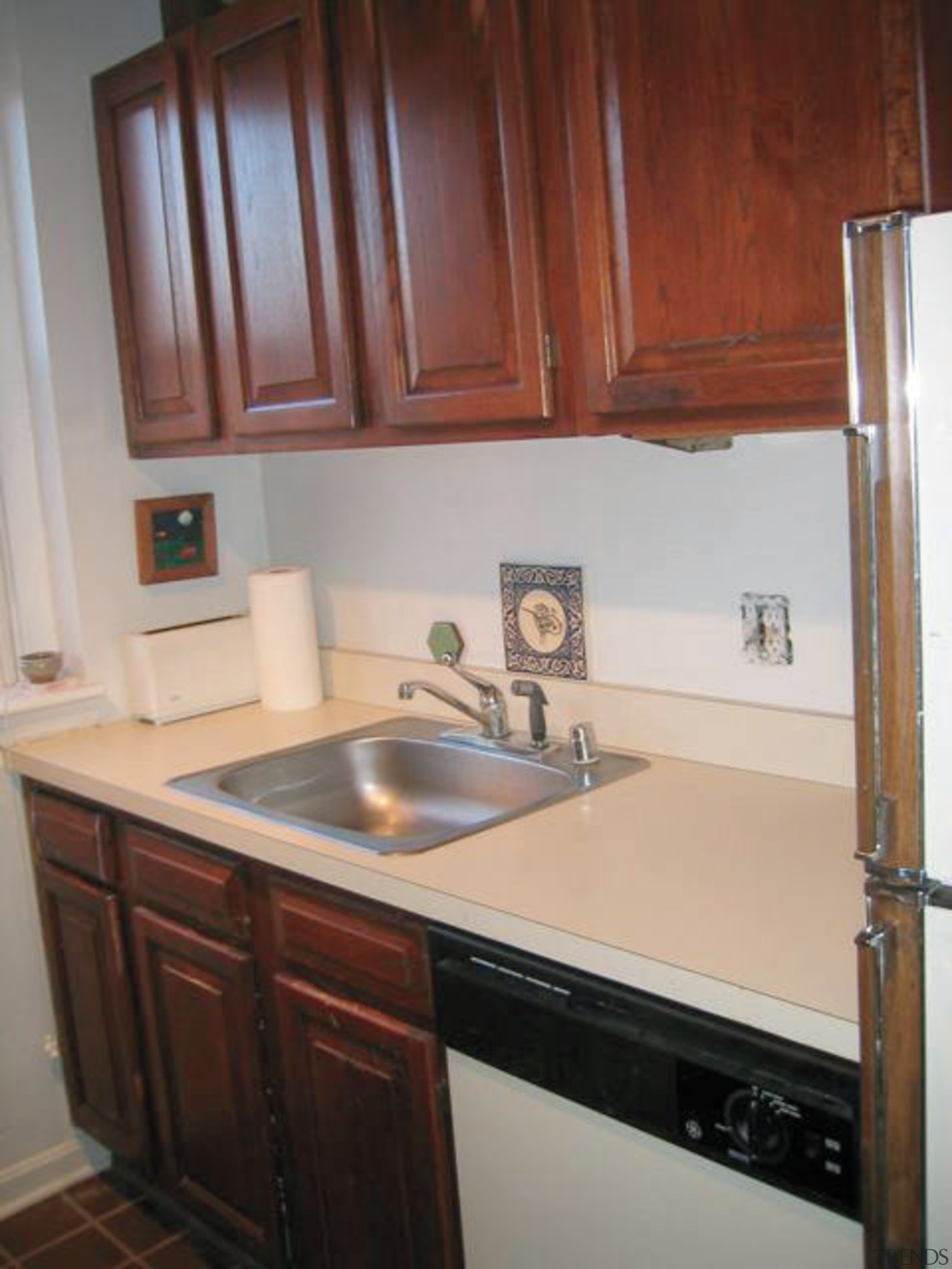 A view of the kitchen area before it cabinetry, countertop, cuisine classique, floor, furniture, hardwood, home, home appliance, kitchen, major appliance, property, room, sink, gray, red