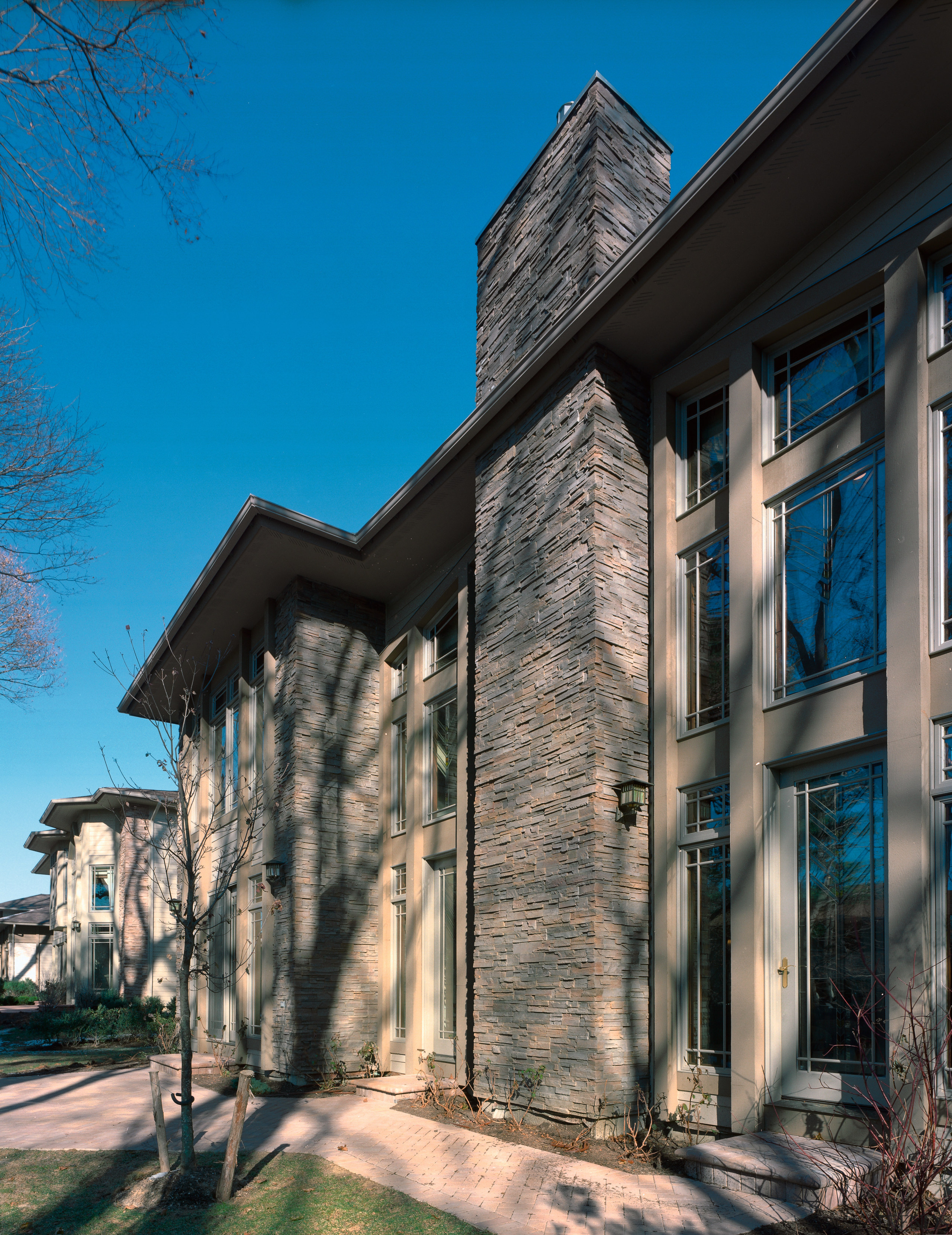 Exterior view of apartment houses with stone cladding architecture, building, estate, facade, home, house, neighbourhood, real estate, residential area, sky, tree, window, black, gray