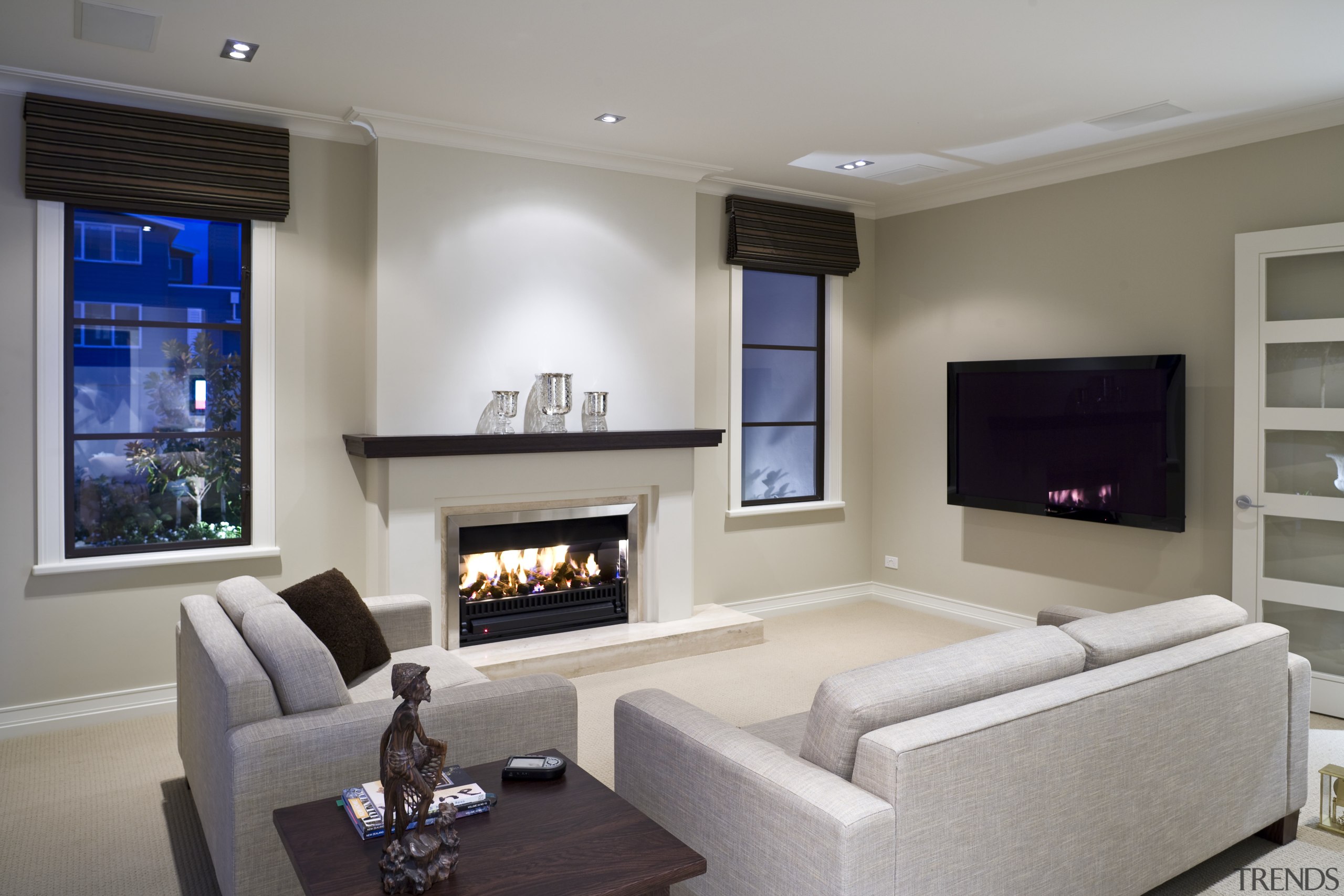 View of a living area inside this Mediterranean-style fireplace, hearth, home, interior design, living room, property, real estate, room, gray