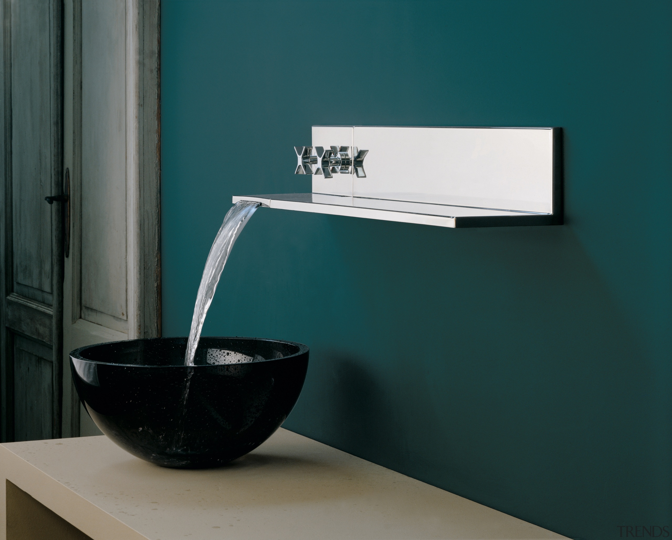 A view of some bathroomware by Rubinetterie Ritmonio. bathroom sink, glass, plumbing fixture, product design, sink, tap, teal, black