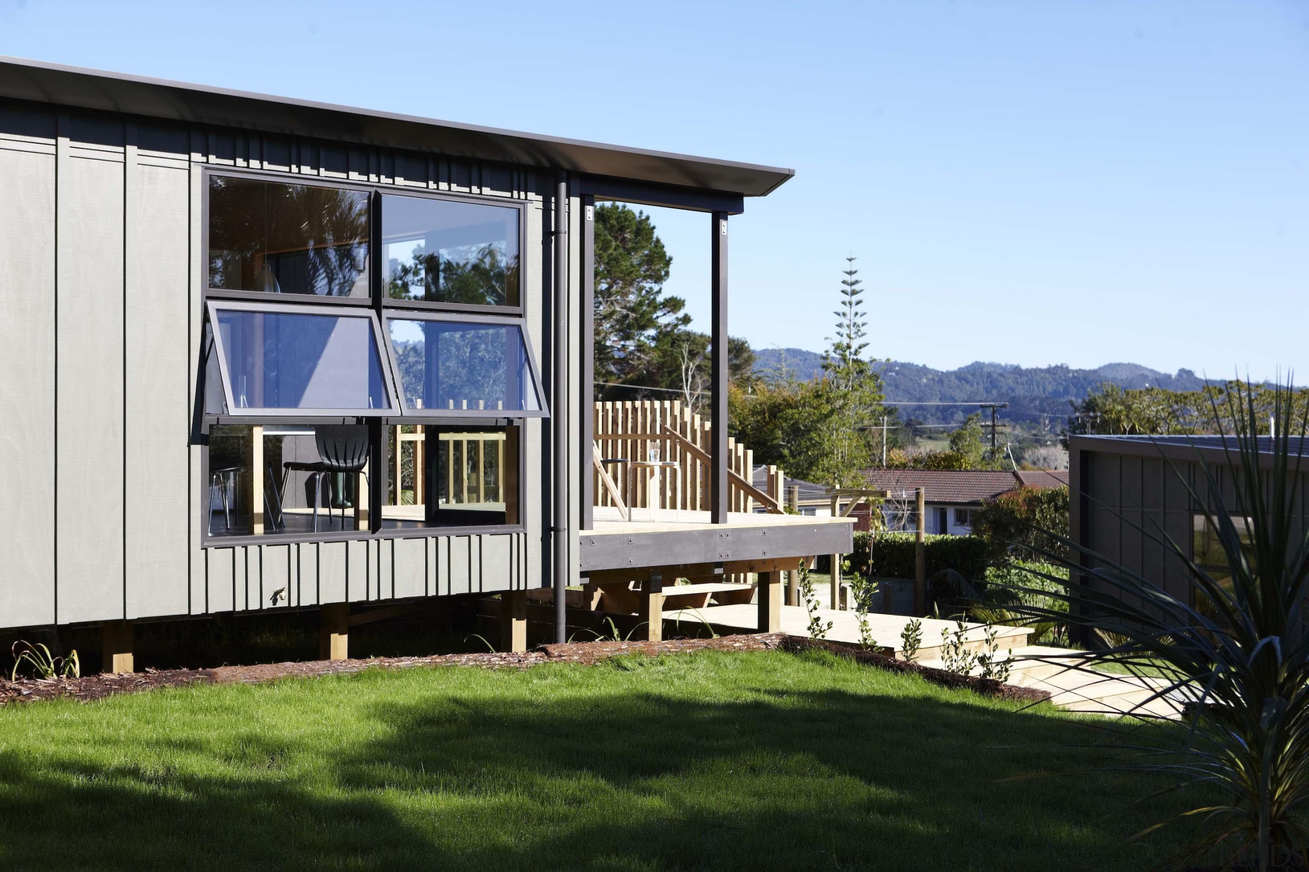 Waitakere Ranges - Studio 19 VisionWest Community Housing architecture, cottage, facade, home, house, property, real estate, teal, black